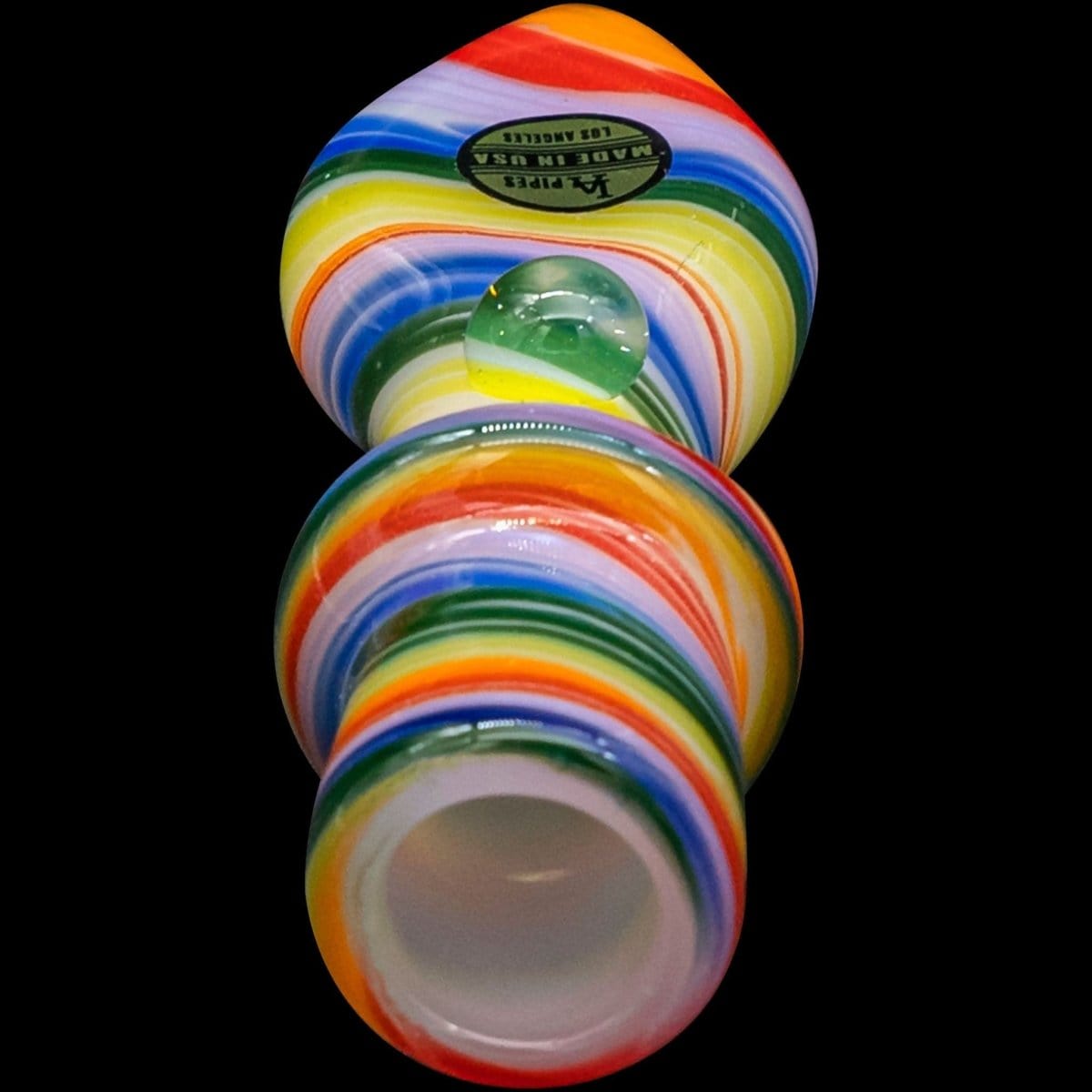 A detailed close-up of the “Rainbow Tornado” Chillum Pipe, showing its colorful, spiraled design against a dark background.
