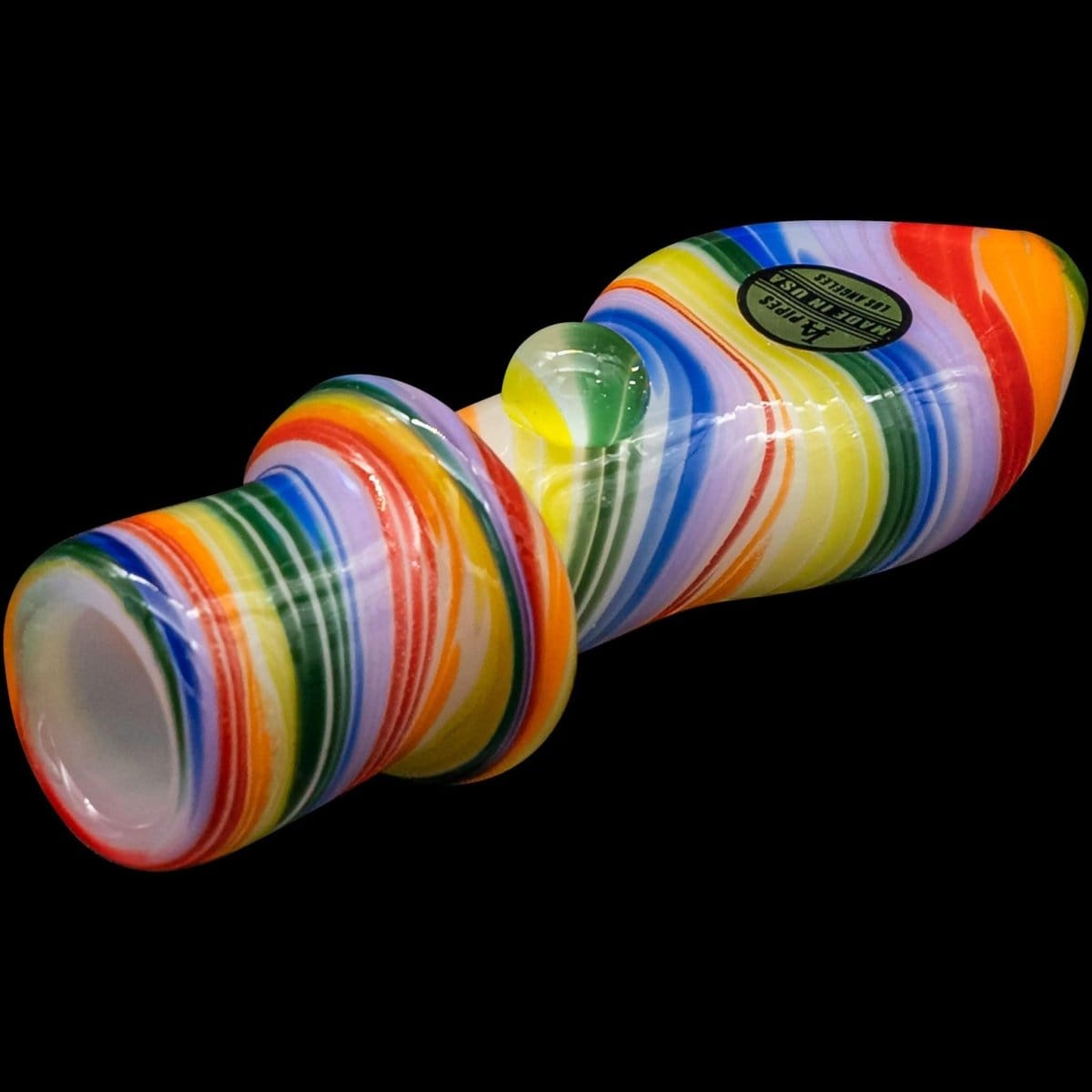 A close-up, angled view of the “Rainbow Tornado” Chillum Pipe, showcasing its colorful, swirling glass design.