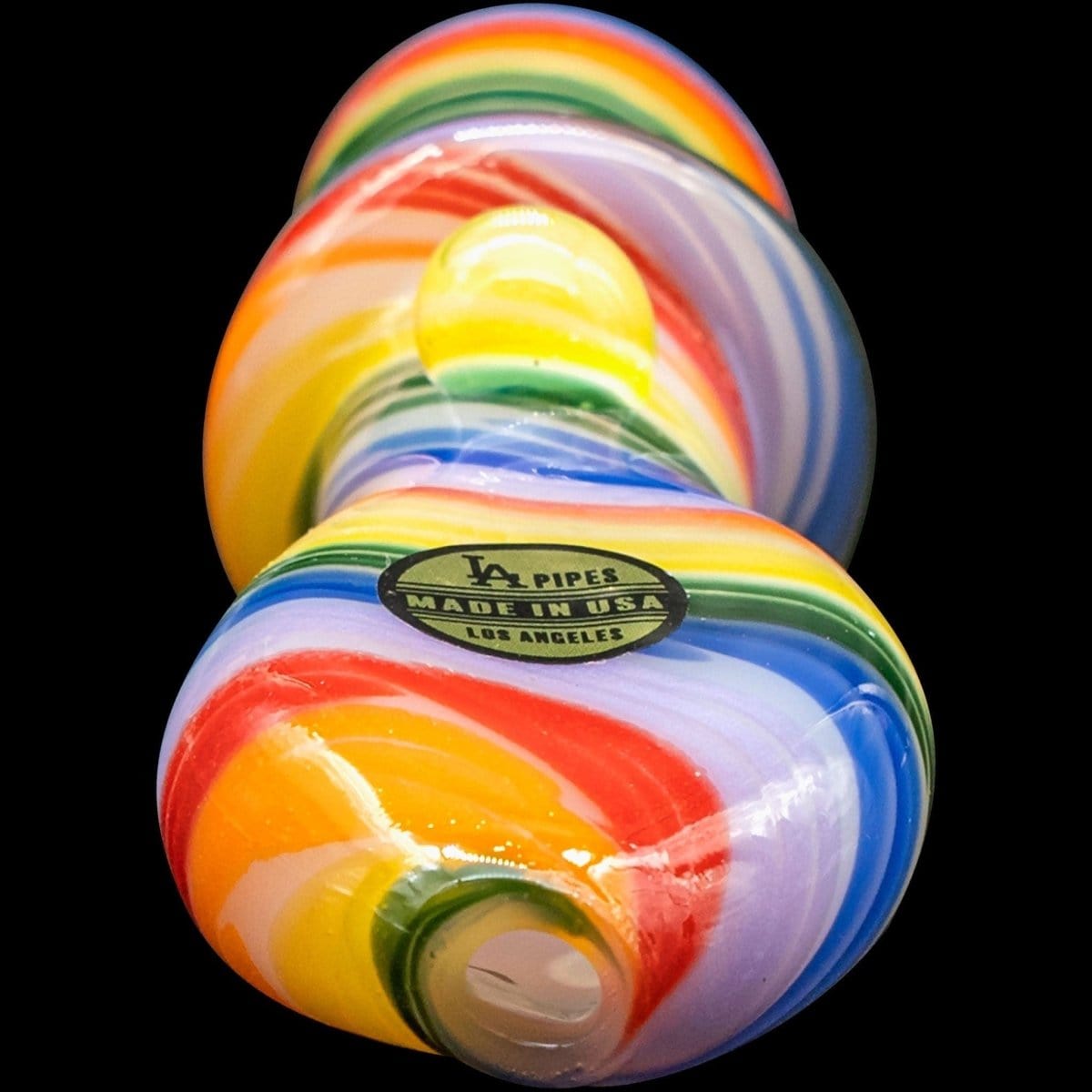 A close-up, angled view of the “Rainbow Tornado” Chillum Pipe, featuring vibrant swirling colors against a black background.