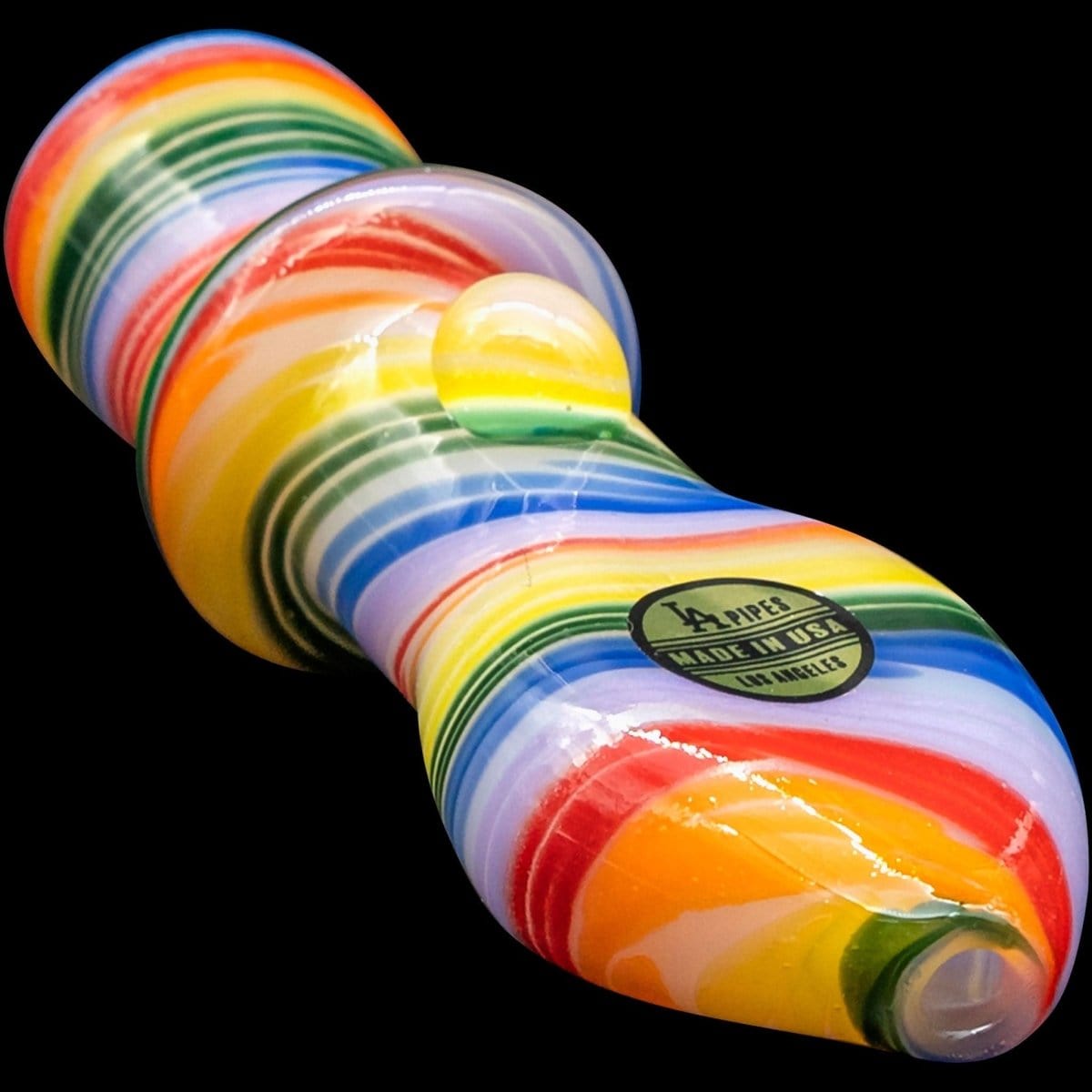 A close-up, angled view of the “Rainbow Tornado” Chillum Pipe, showcasing its vibrant, swirling color pattern against a dark background.