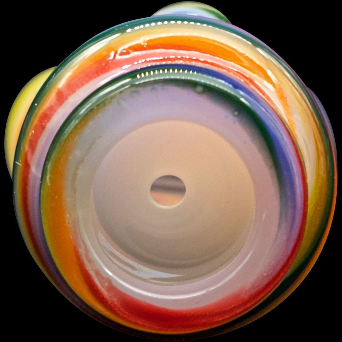 A close-up, front view of the “Rainbow Tornado” Chillum Pipe, showcasing its colorful, swirling design and open mouthpiece.