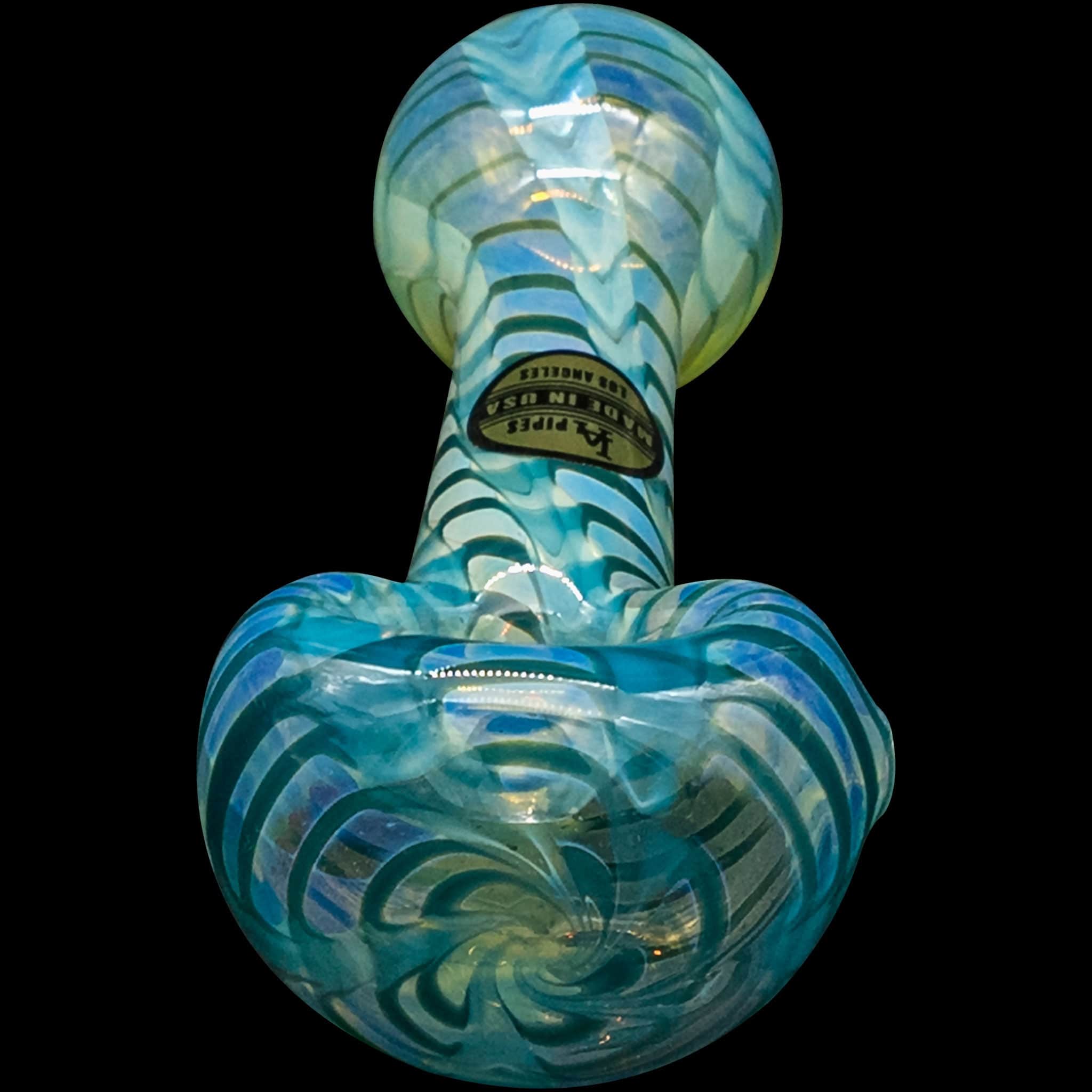 A detailed studio shot of the “Raker” Glass Spoon Pipe, displaying its colorful, curved glass design against a black background.