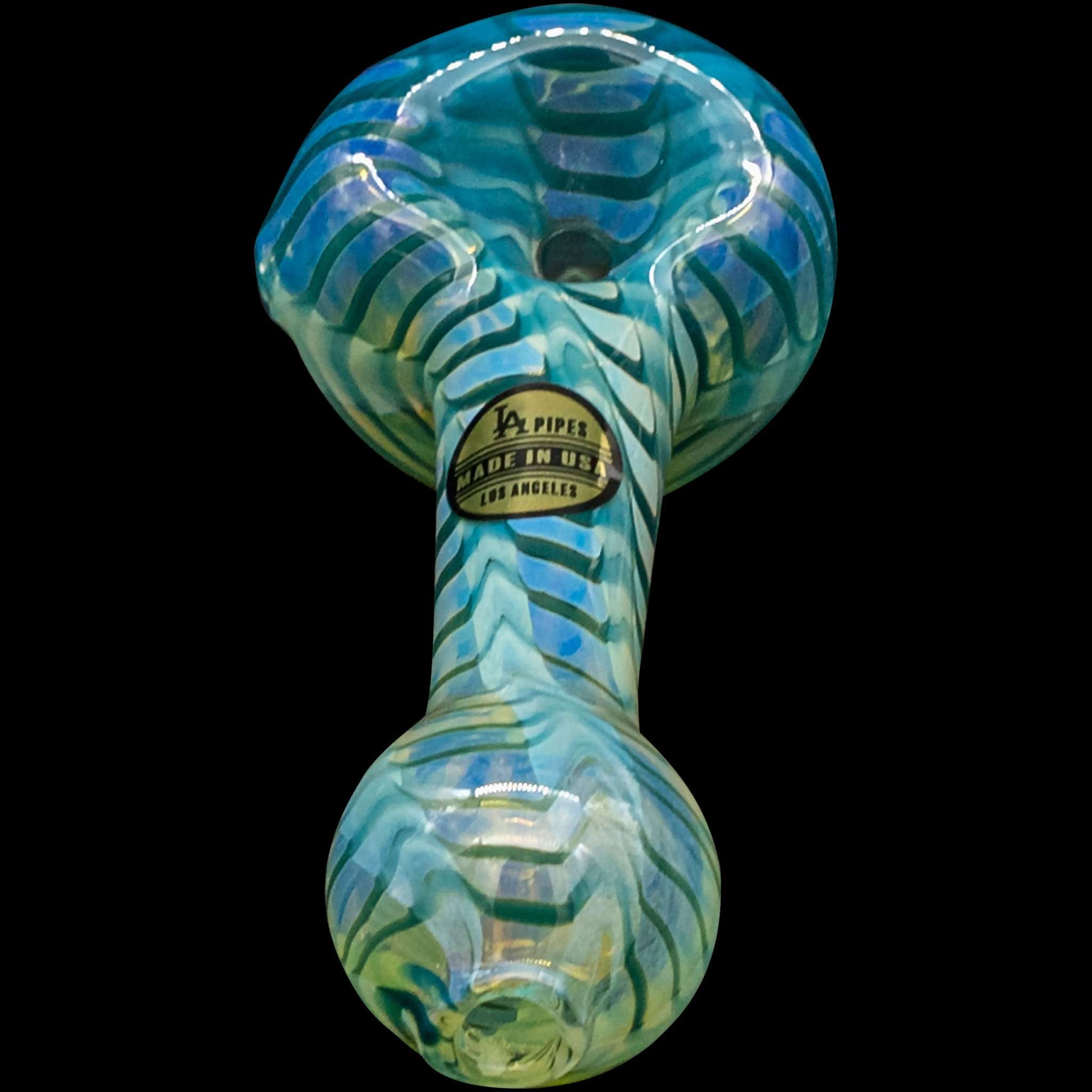 A studio shot of the “Raker” Glass Spoon Pipe, showcasing its swirled blue and green glass design from a slightly angled front view.