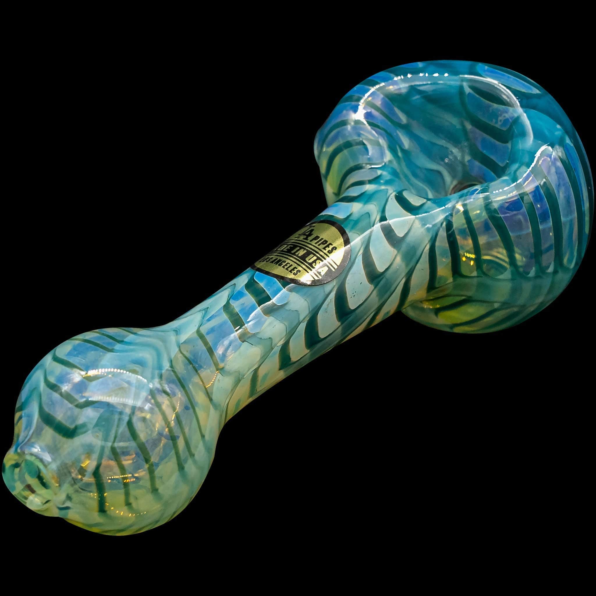 A close-up of the “Raker” Glass Spoon Pipe, showcasing its colorful, swirling glass design against a dark background.