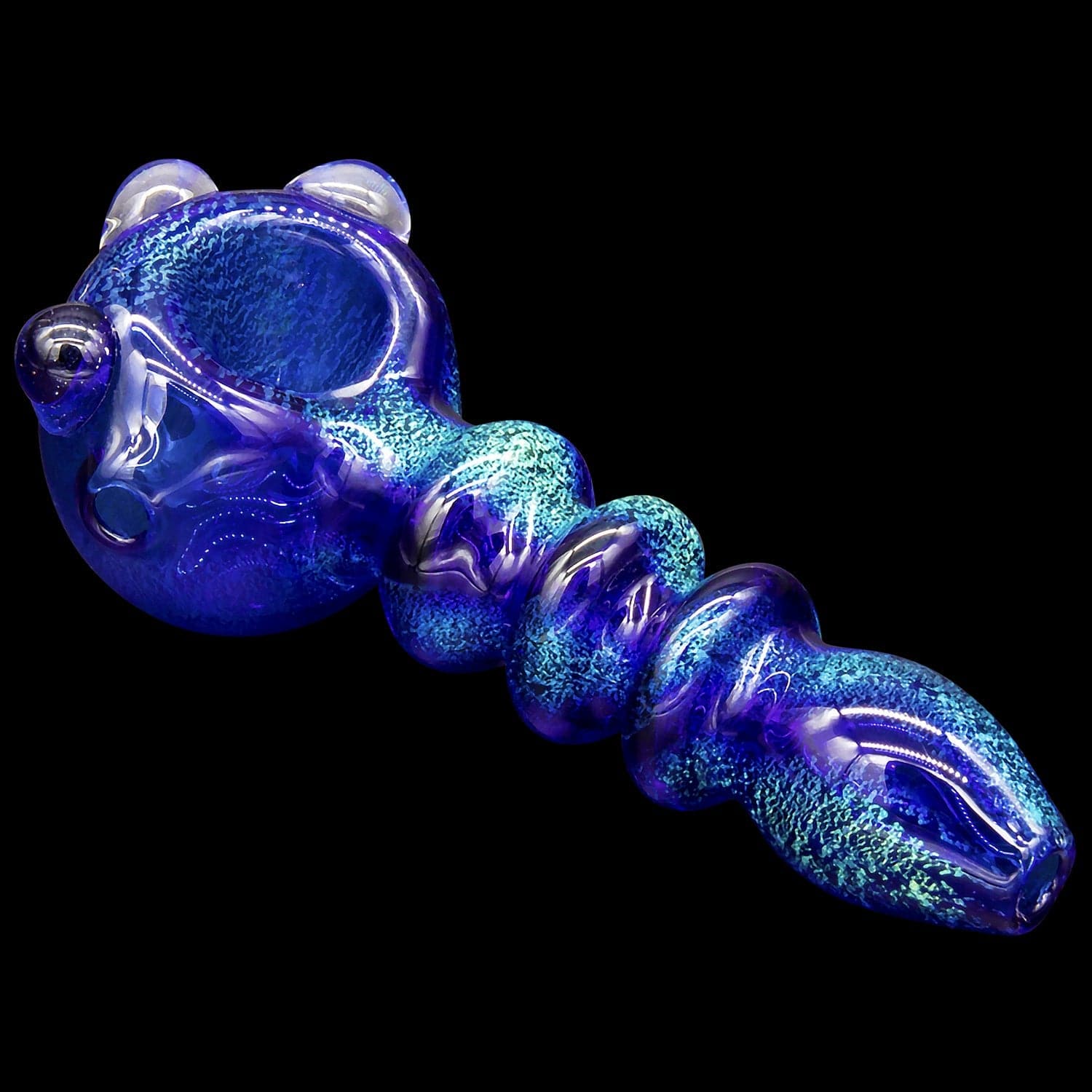 A close-up, angled view of the “Ringed Maria” Dichro Spoon Pipe, displaying colorful, swirling patterns within its clear glass body.