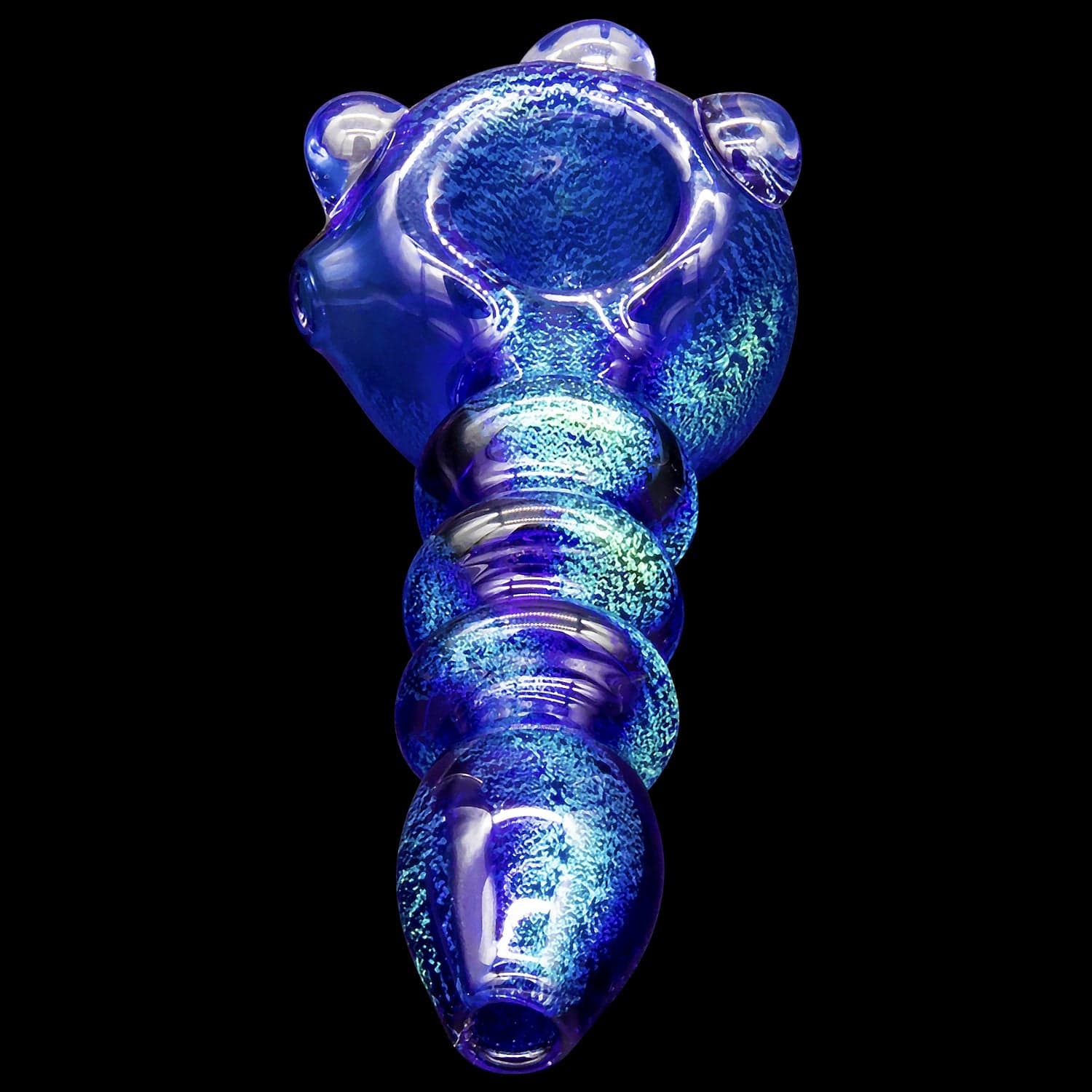 A studio shot of the “Ringed Maria” Dichro Spoon Pipe, displaying its colorful, ringed pattern and dichroic sheen.