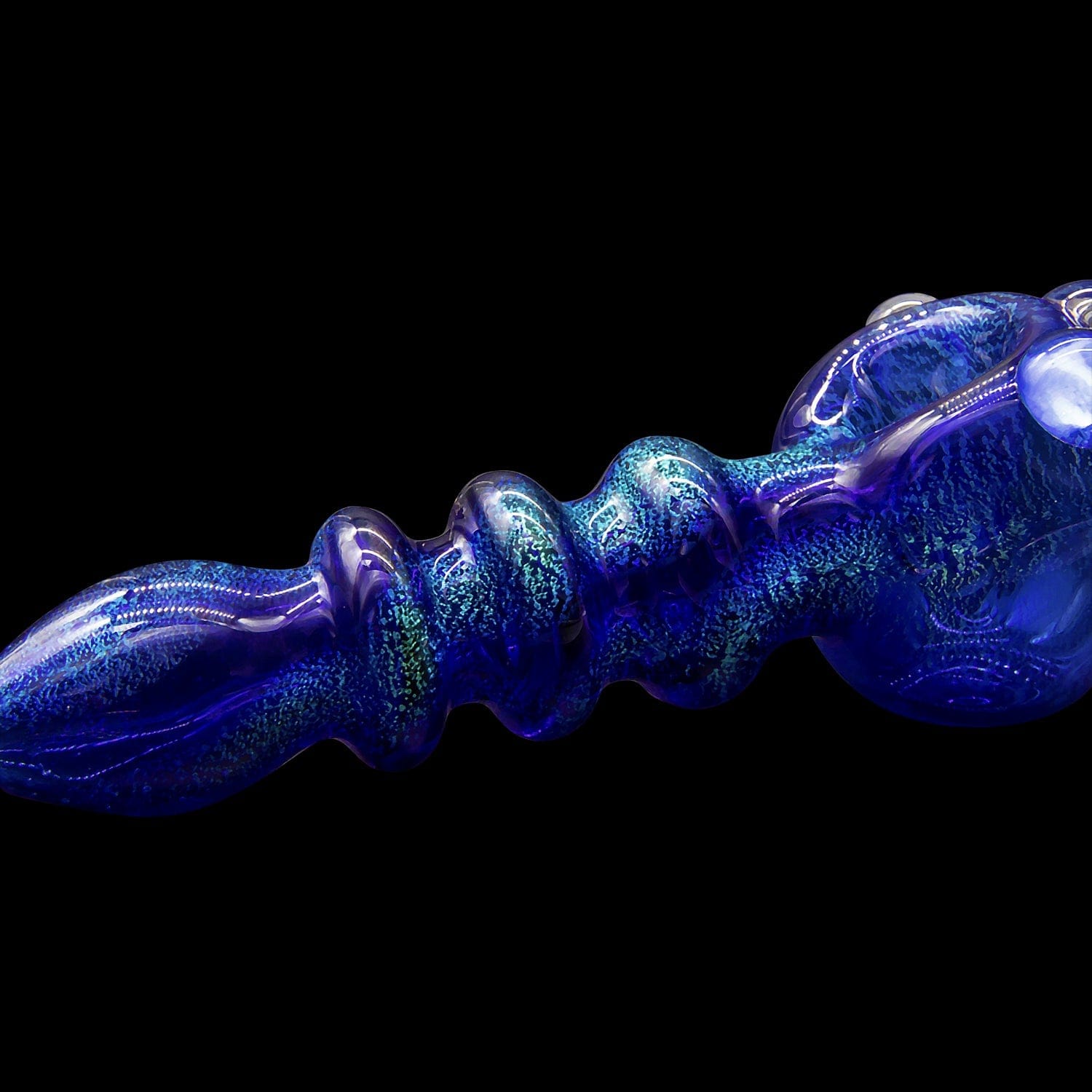 A side view of the “Ringed Maria” Dichro Spoon Pipe, showcasing the swirling blue and silver dichroic glass pattern.