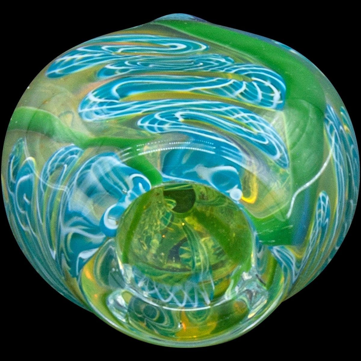 A close-up, angled view showcases the "Skipping Stone" Inside-Out Chillum with a swirling green and clear glass design.