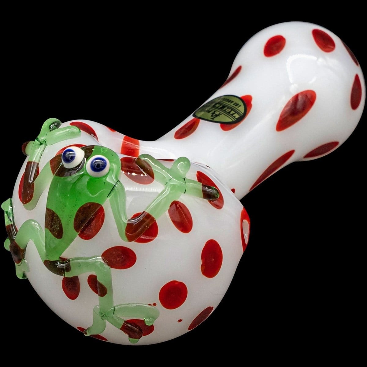 Front view of the "Spotted Poison Frog" spoon glass pipe, featuring a green and red spotted design.