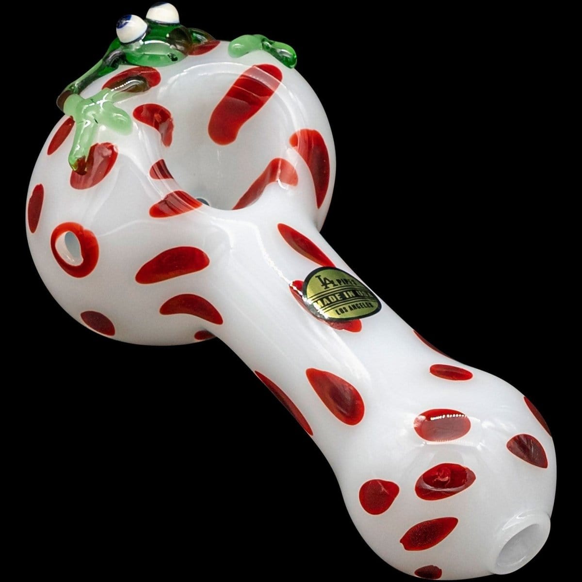 Front view of the “Spotted Poison Frog” Spoon Glass Pipe, featuring a colorful, patterned design on clear glass.