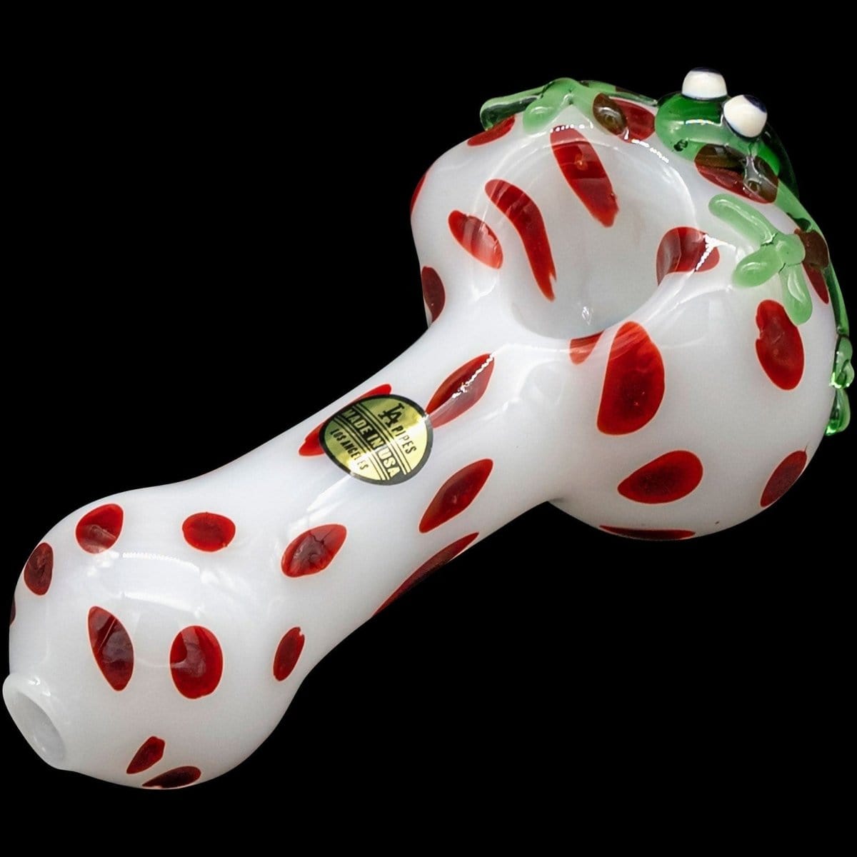 Front view of the “Spotted Poison Frog” Spoon Glass Pipe, featuring a colorful, patterned design against a dark background.