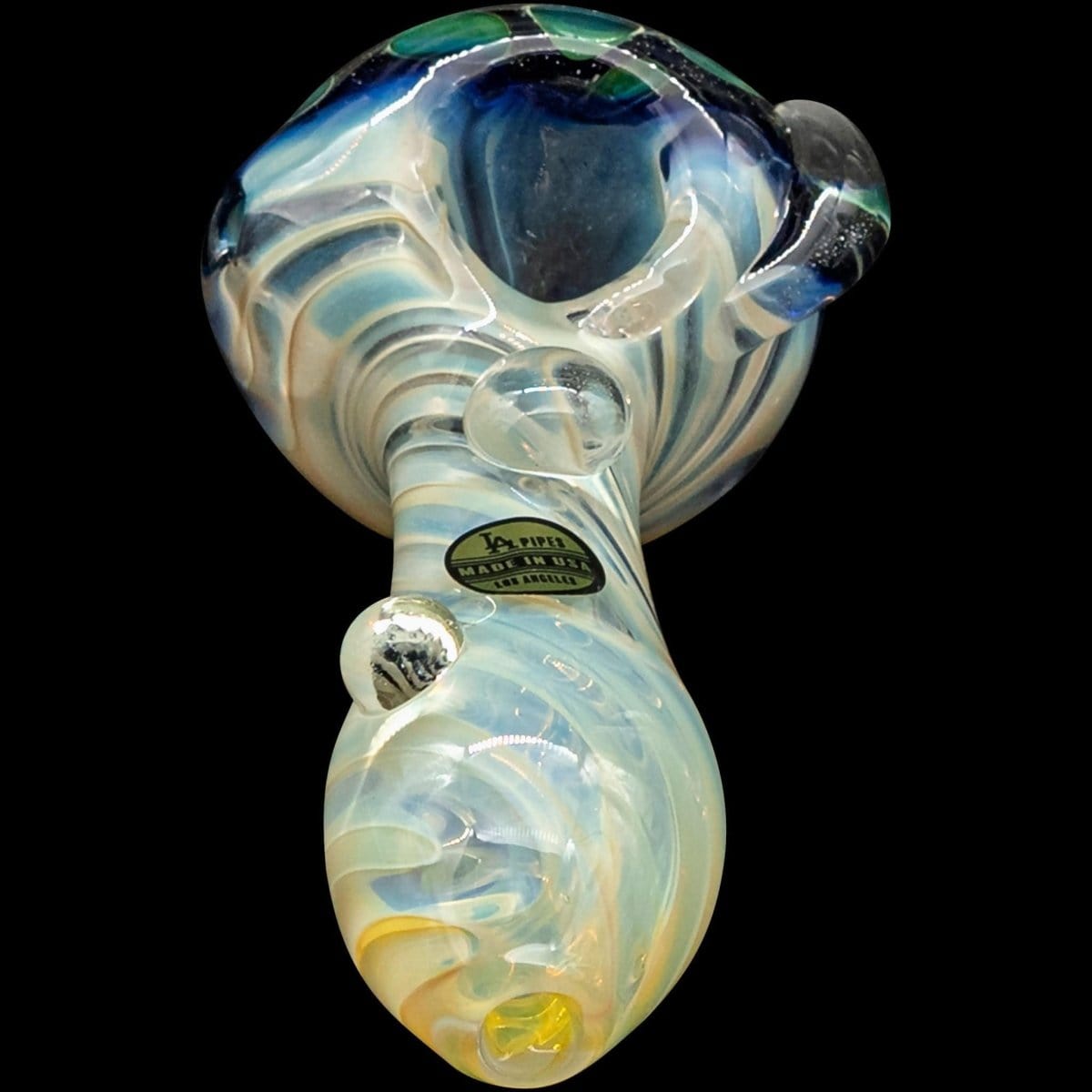 A close-up, angled view of “The Hive” Honeycomb Color Changing Glass Pipe, showcasing its swirling, colorful glass design.