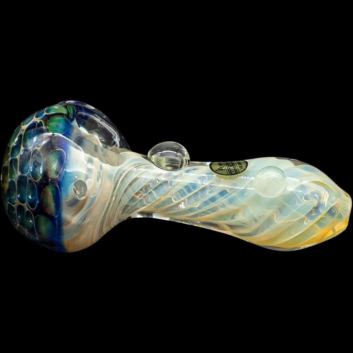 A three-quarter view of “The Hive” Honeycomb Color Changing Glass Pipe with a swirled, iridescent finish.