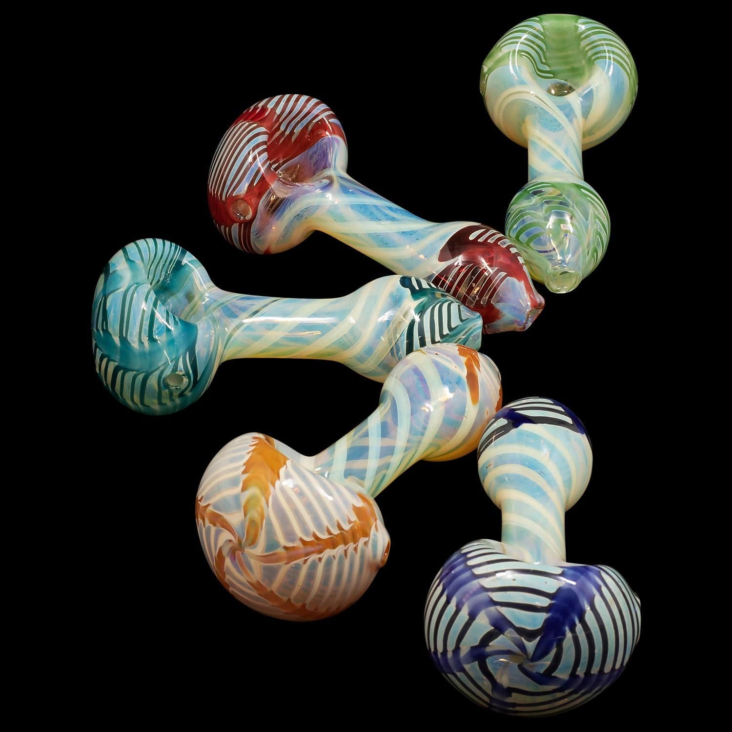 A side view of the “Twisty Cane” Spoon Glass Pipe, showcasing its colorful, curved design against a dark background.