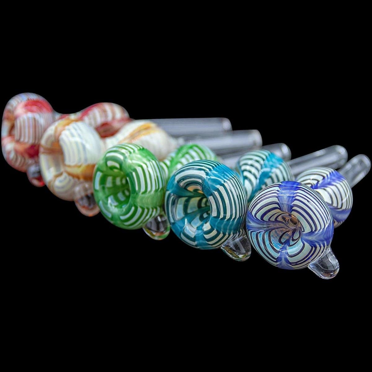 A close-up, angled view of the Wrap-n-Rake Bubble Pull-Stem Slide Bowl, displaying a variety of colorful glass patterns.