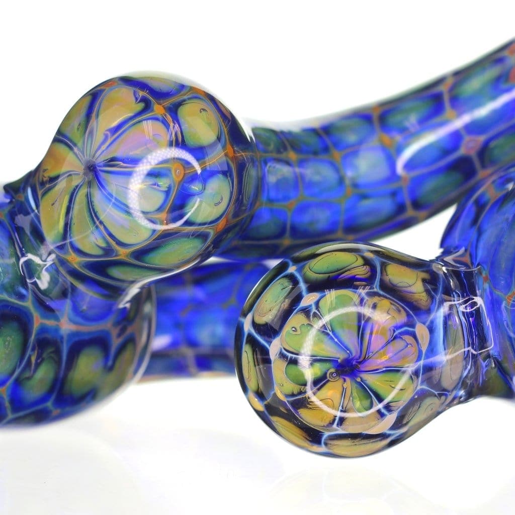 Close-up view of the Blue Scale Bubbler, showcasing a swirling blue and green glass design with a rounded shape.