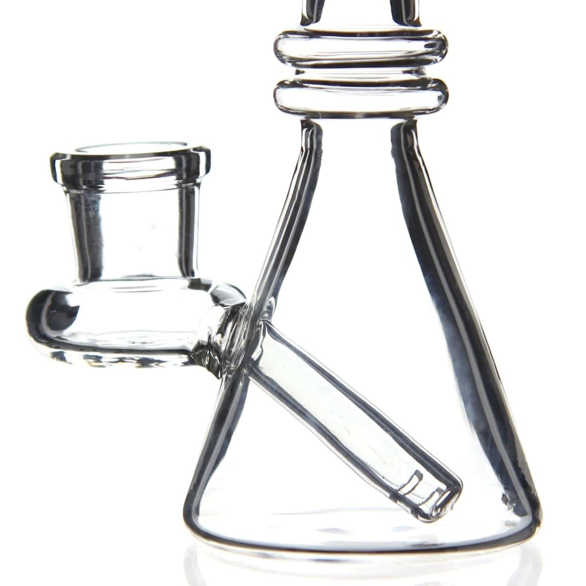 A side view of the Quartz Mini Dab Rig Collection, showcasing its clear glass construction and compact size against a white backdrop.