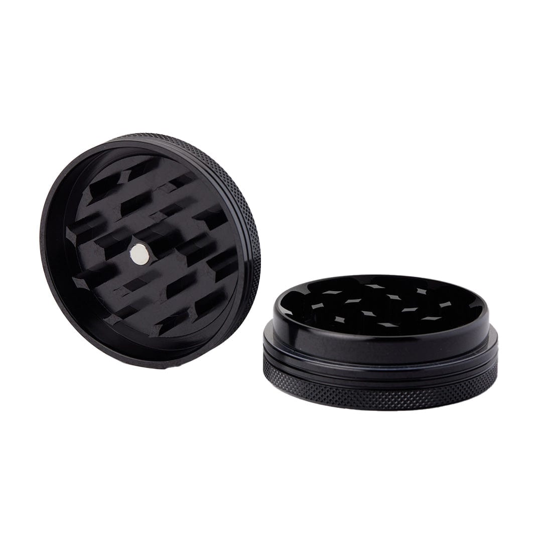 An overhead view of the Meudsa Customs Flat Grinders, showcasing the dark, textured metal with visible internal grinding teeth.