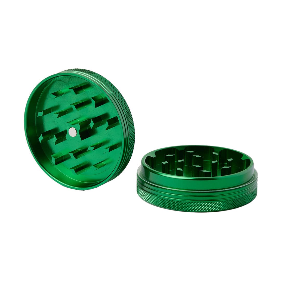 A top-down view of the Meudsa Customs Flat Grinders, showcasing its circular metal design and internal grinding teeth.