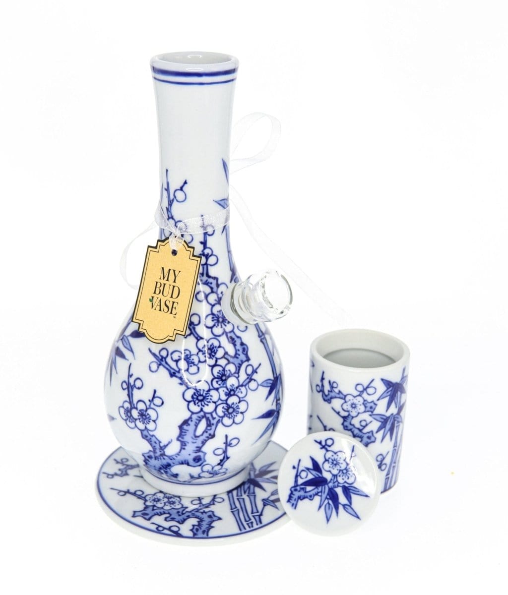 A detailed studio shot of the My Bud Vase "Luck" Chinese Porcelain Vase Bong, showcasing its intricate floral design and white porcelain finish.