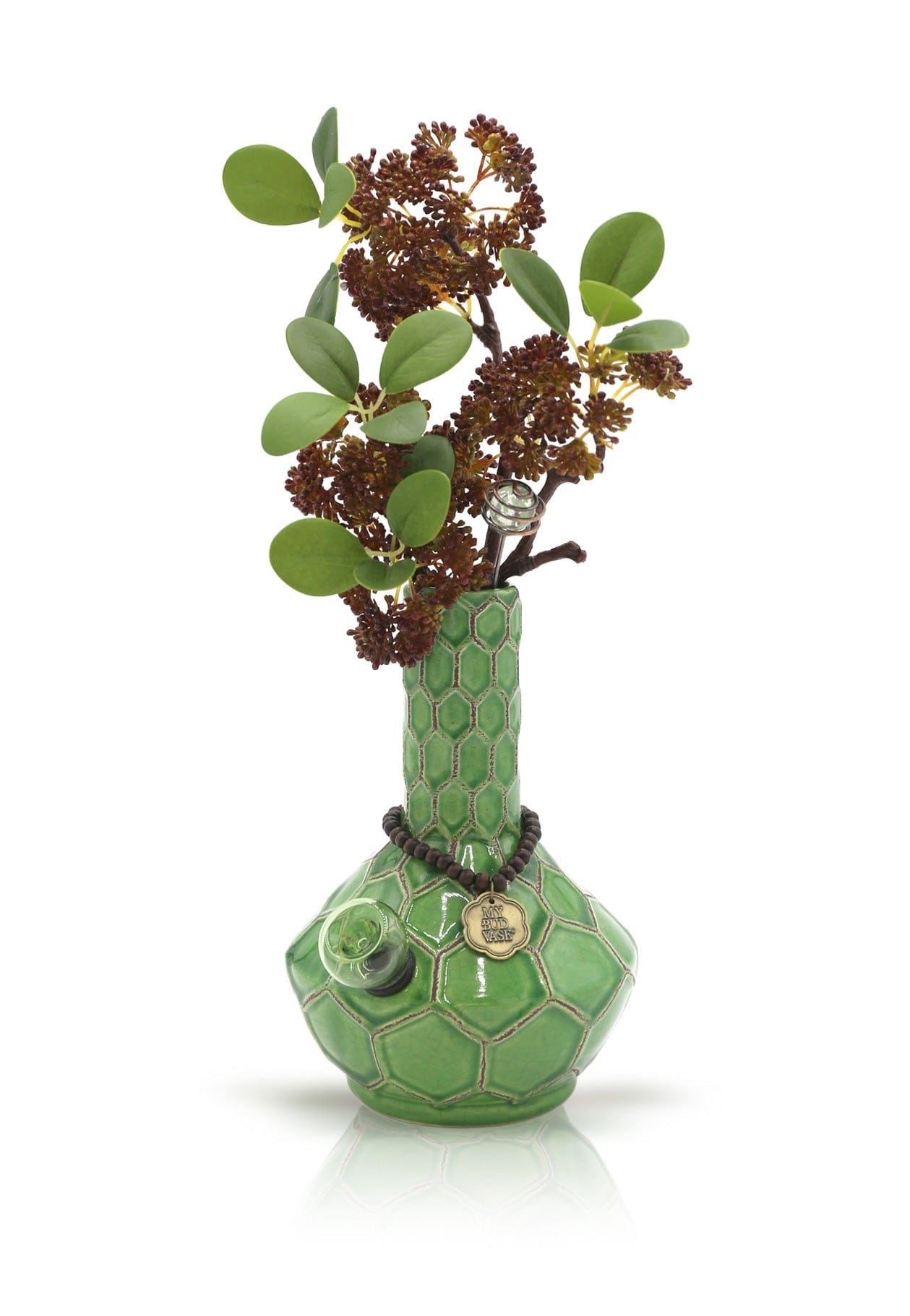 A close-up of the Turtle Spiritual Grounding Vase with a textured, green finish and a sprig of leafy greens inside.