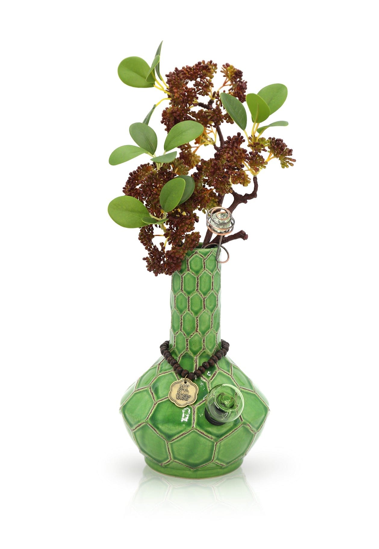 Front view of the Turtle Spiritual Grounding Vase 🐢, showcasing a green glass vessel with a textured surface and small, leafy sprigs arranged within.