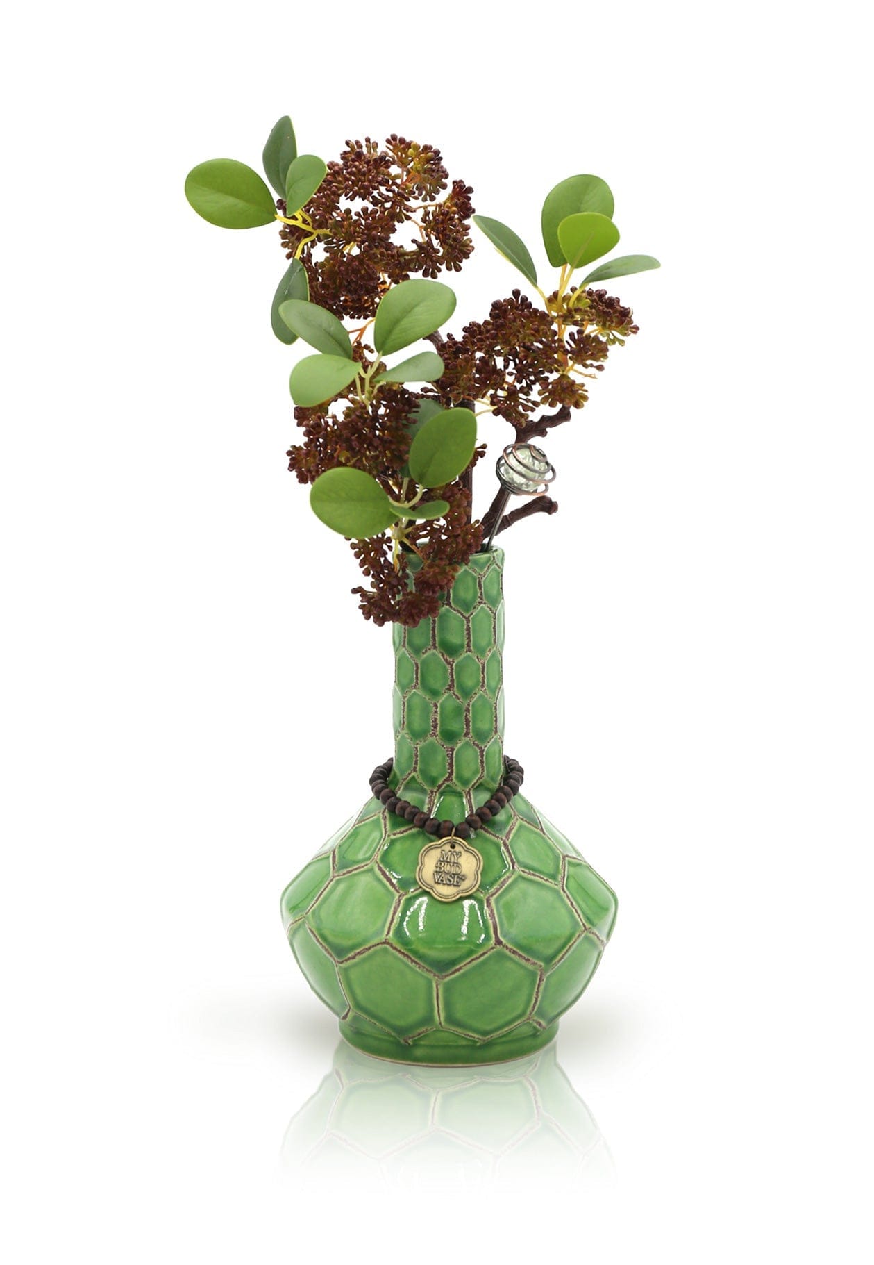 Front view of the Turtle Spiritual Grounding Vase, featuring a textured green glass body and delicate floral arrangement.