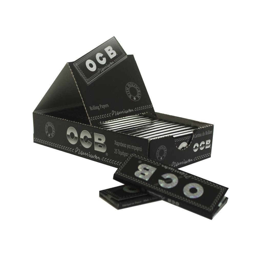 A stack of OCB - Premium Single Wide Rolling Papers against a plain white backdrop, shown at a slight angle.