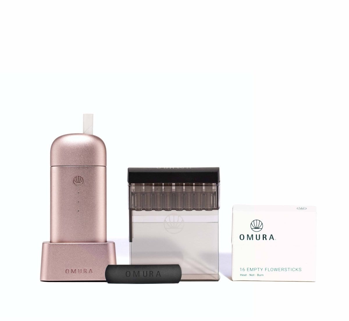 Front view of the Omura Series X Complete Bundle, showcasing a sleek device next to its packaged contents on a white surface.