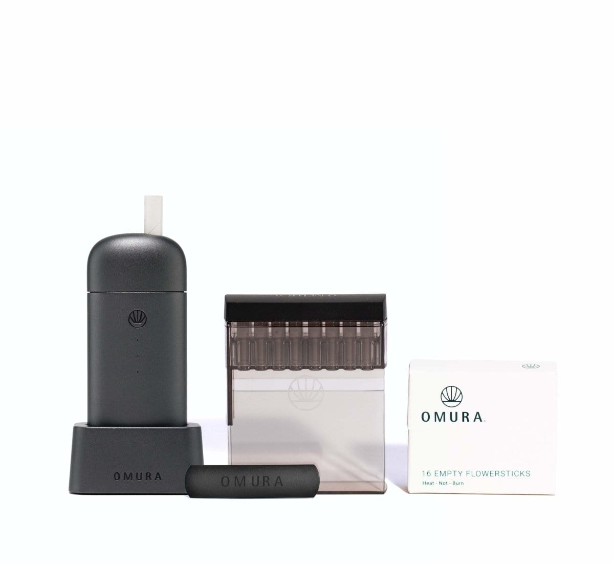 Front view of the Omura Series X Complete Bundle, displaying the device and its packaging in a minimalist, studio-lit arrangement.