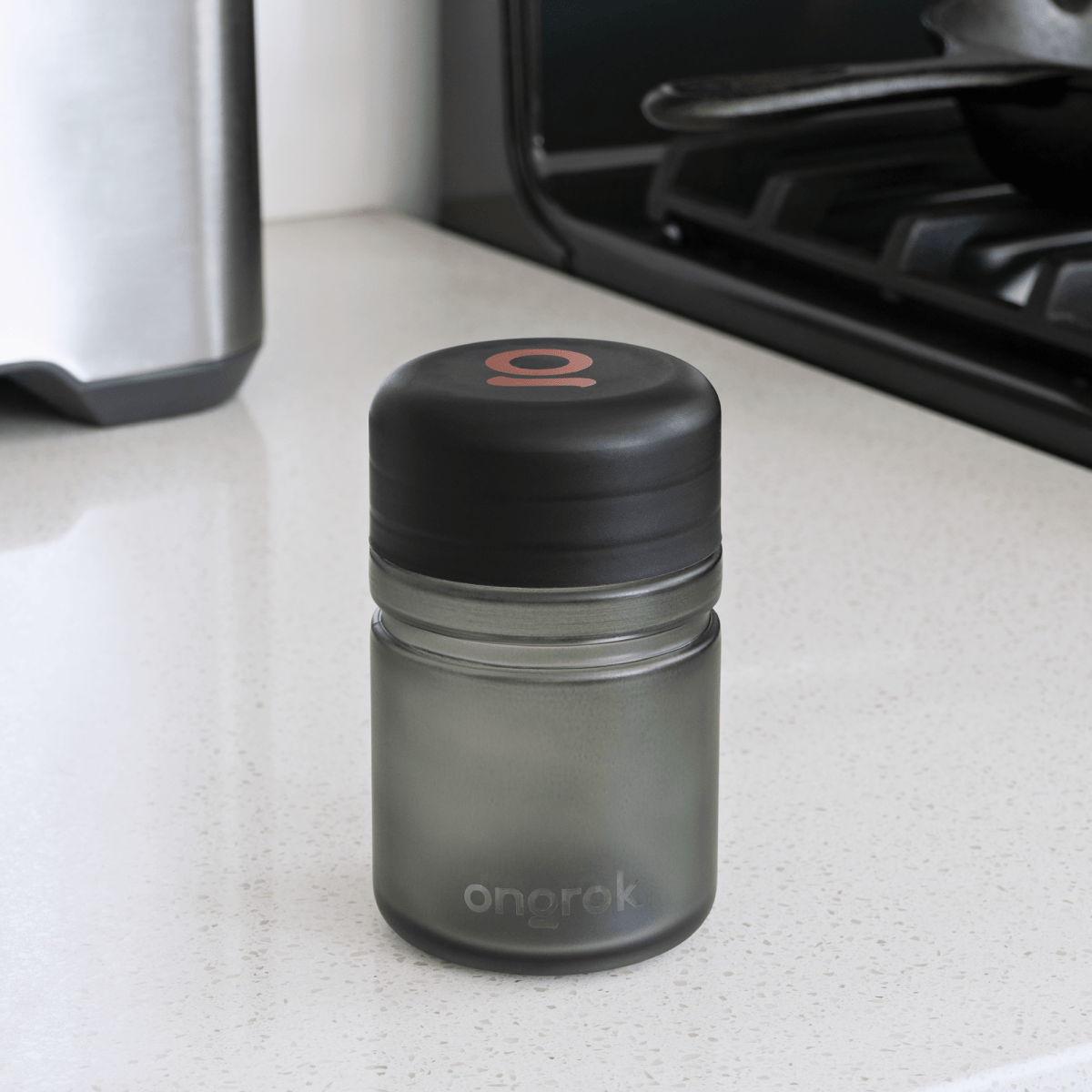 A front view of the Child Resistant Glass Storage Jar, showcasing its clear glass construction and simple cylindrical shape.