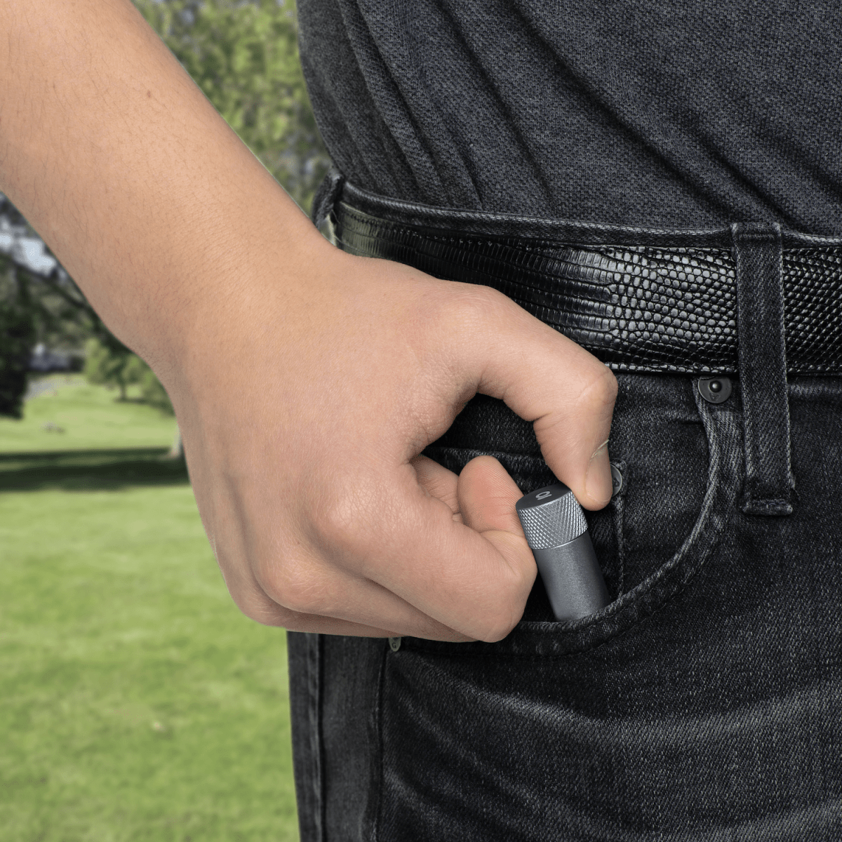 A close-up, angled view shows the Premium Storage Tube  Single held against a textured black background.