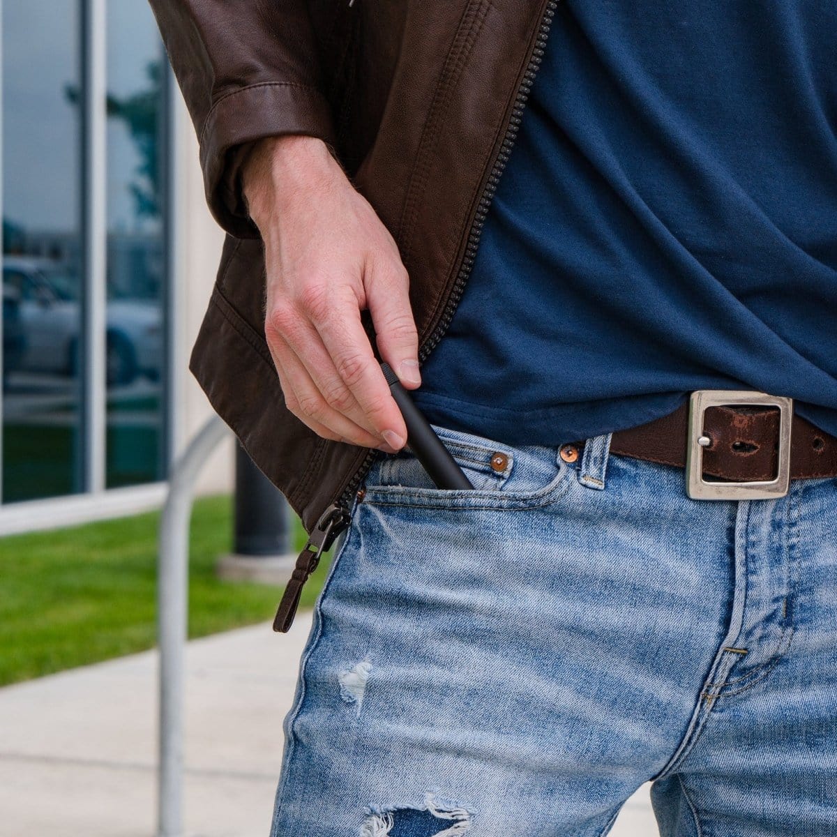 A close-up, angled view shows the Premium Storage Tube  Single partially visible in a jacket pocket.