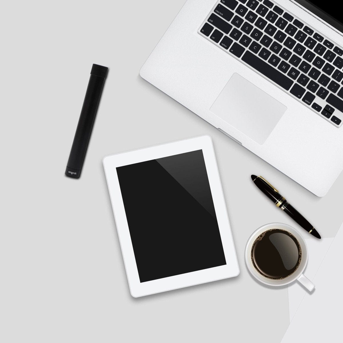 Overhead view featuring the Premium Storage Tube  Single next to a coffee cup and keyboard on a white surface.