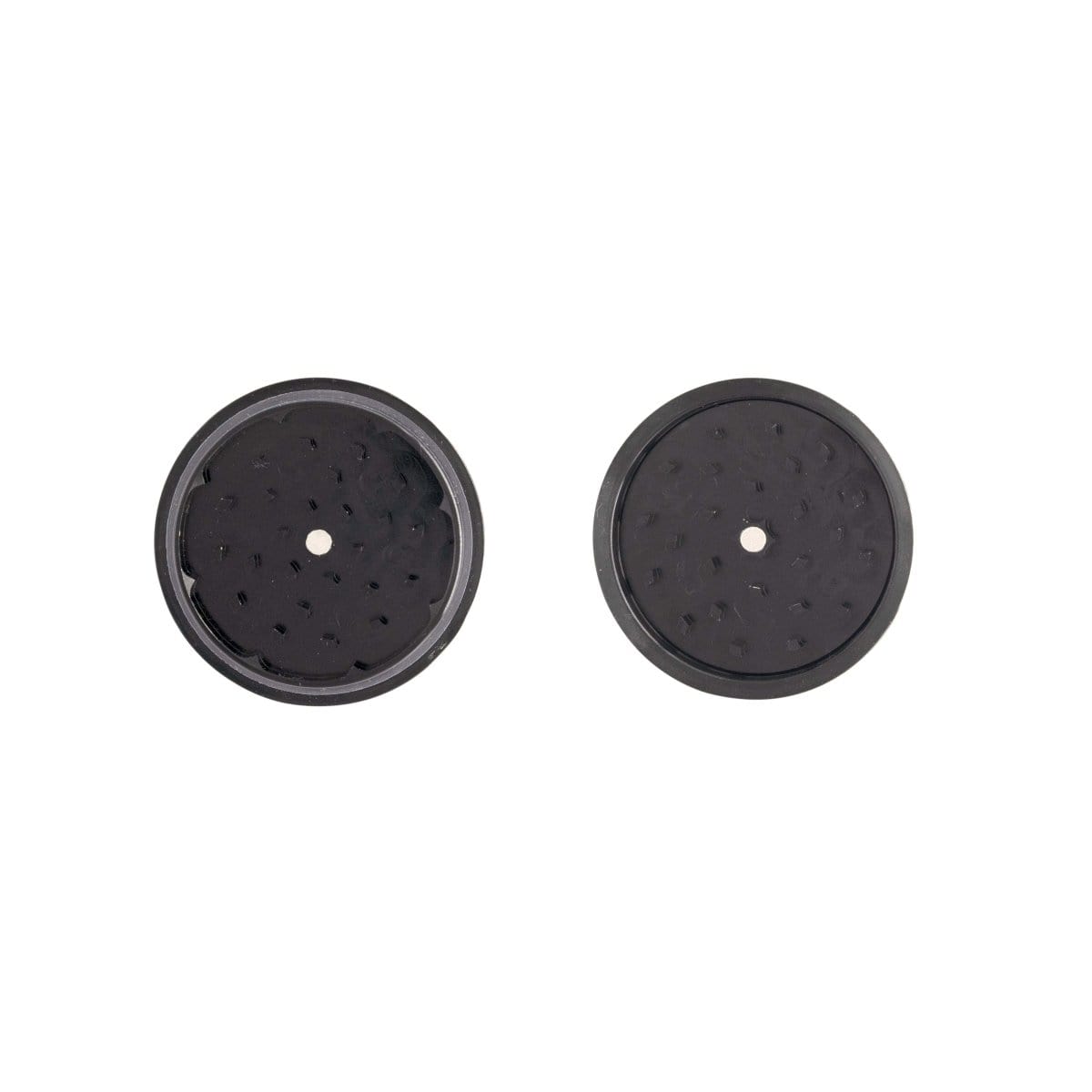 A top-down view of the 3 Inch, 2-Piece Walnut Grinder, showcasing its circular design and metallic interior on a plain black background.