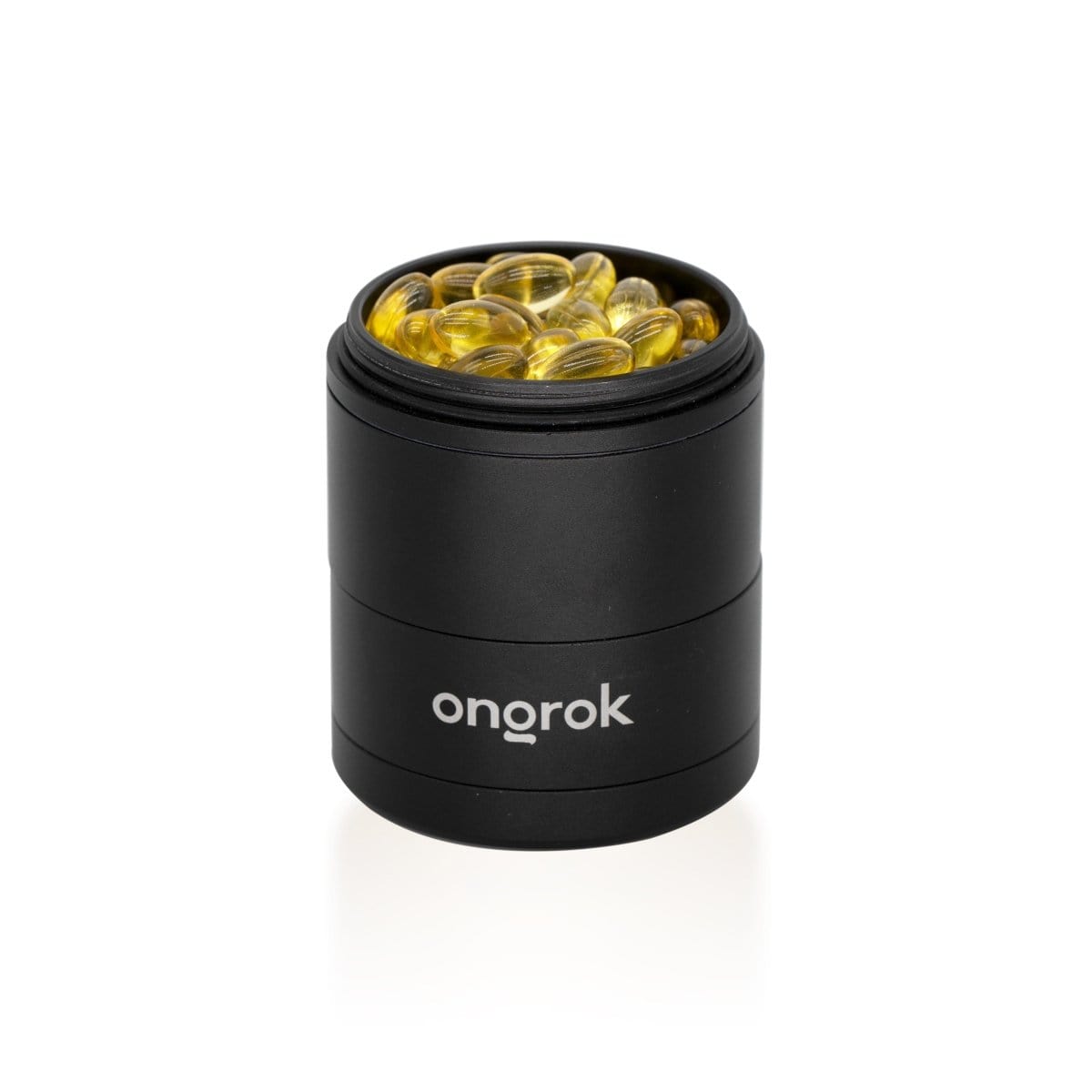 A top-down view of the 5 Piece Storage Grinder filled with small, golden-colored contents.