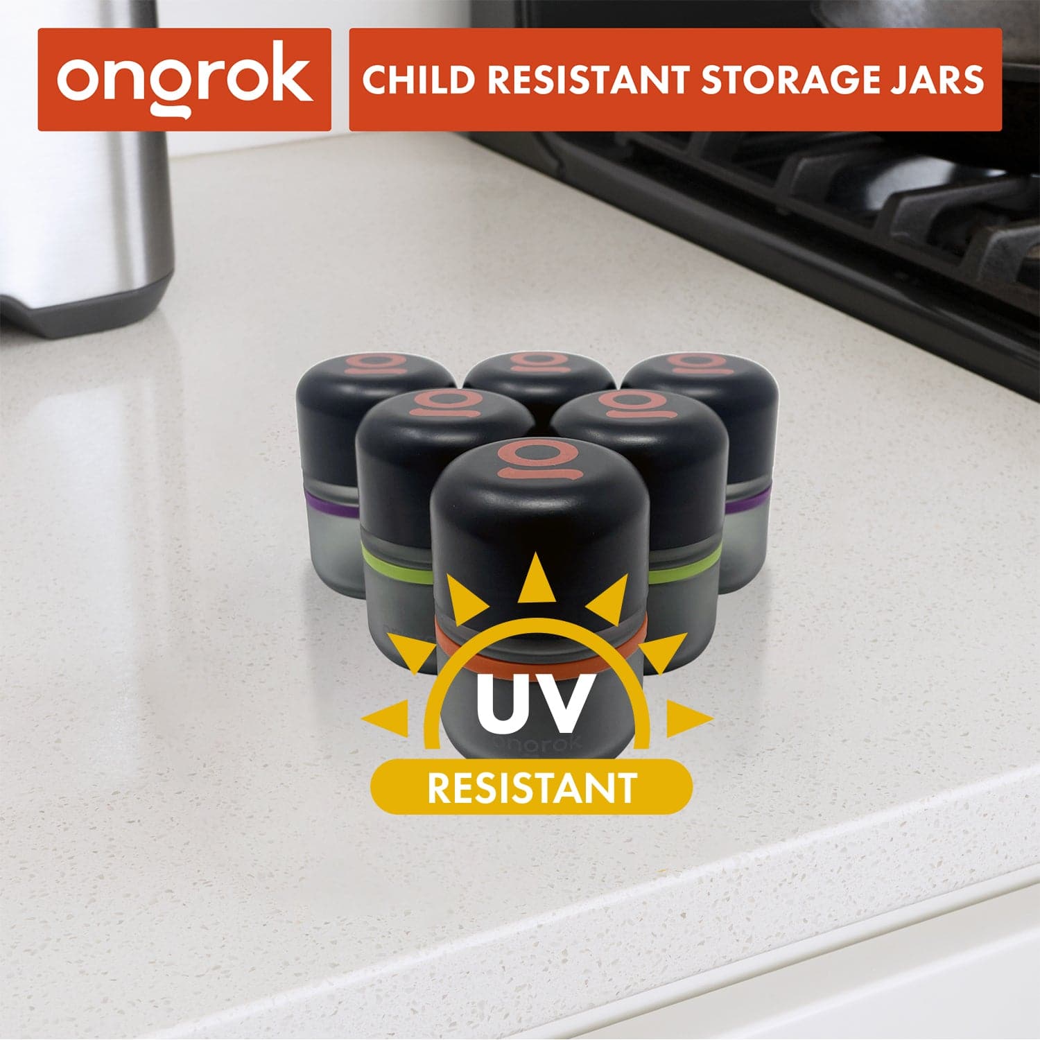Angled close-up of six 80ml Child Resistant Jar | 6 Pack jars with black lids and colored bands on a white kitchen countertop.