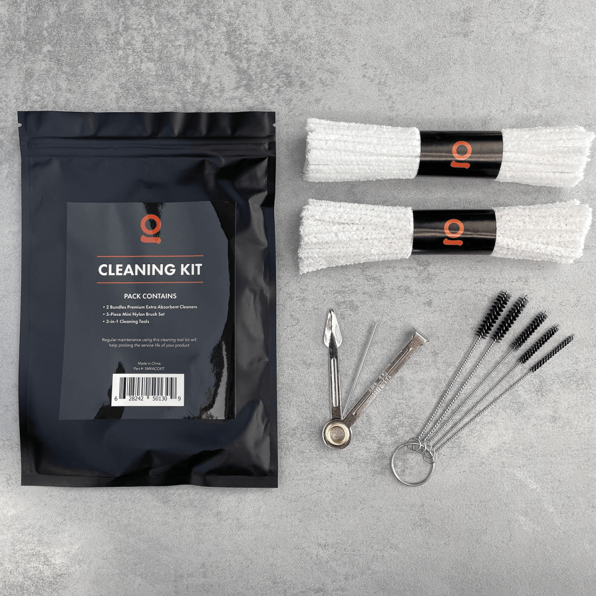 The Accessory Cleaning Kit is displayed with its packaging, showcasing the tools inside against a dark background.
