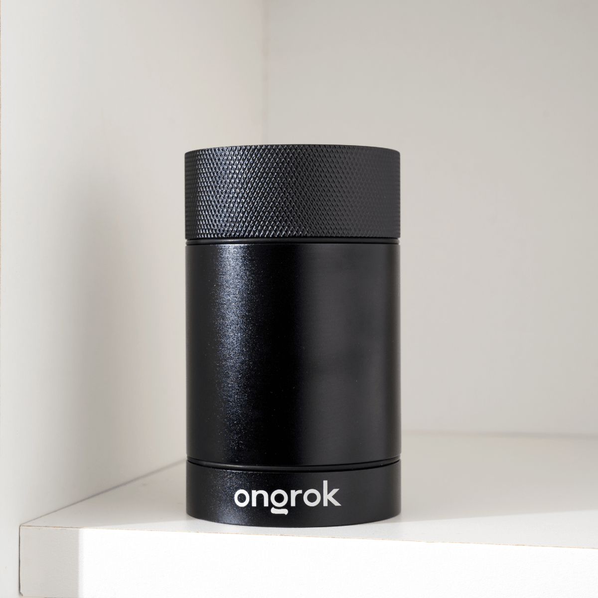 A front view of the Aluminum Metal Storage Jar on a white surface with soft, diffused lighting.