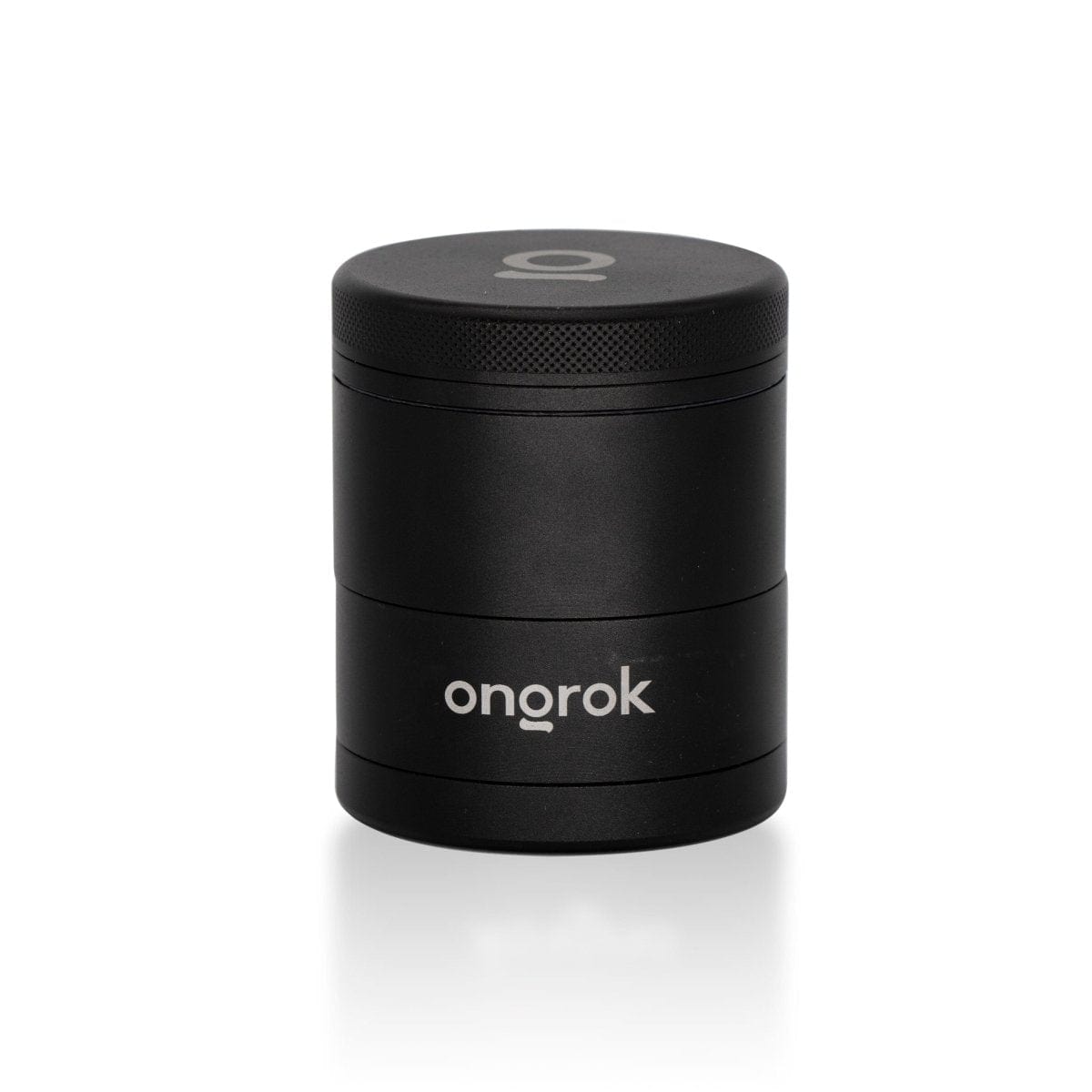 A studio shot of the 5 Piece Storage Grinder, showcasing its sleek cylindrical design and reflective surface on a plain white background.