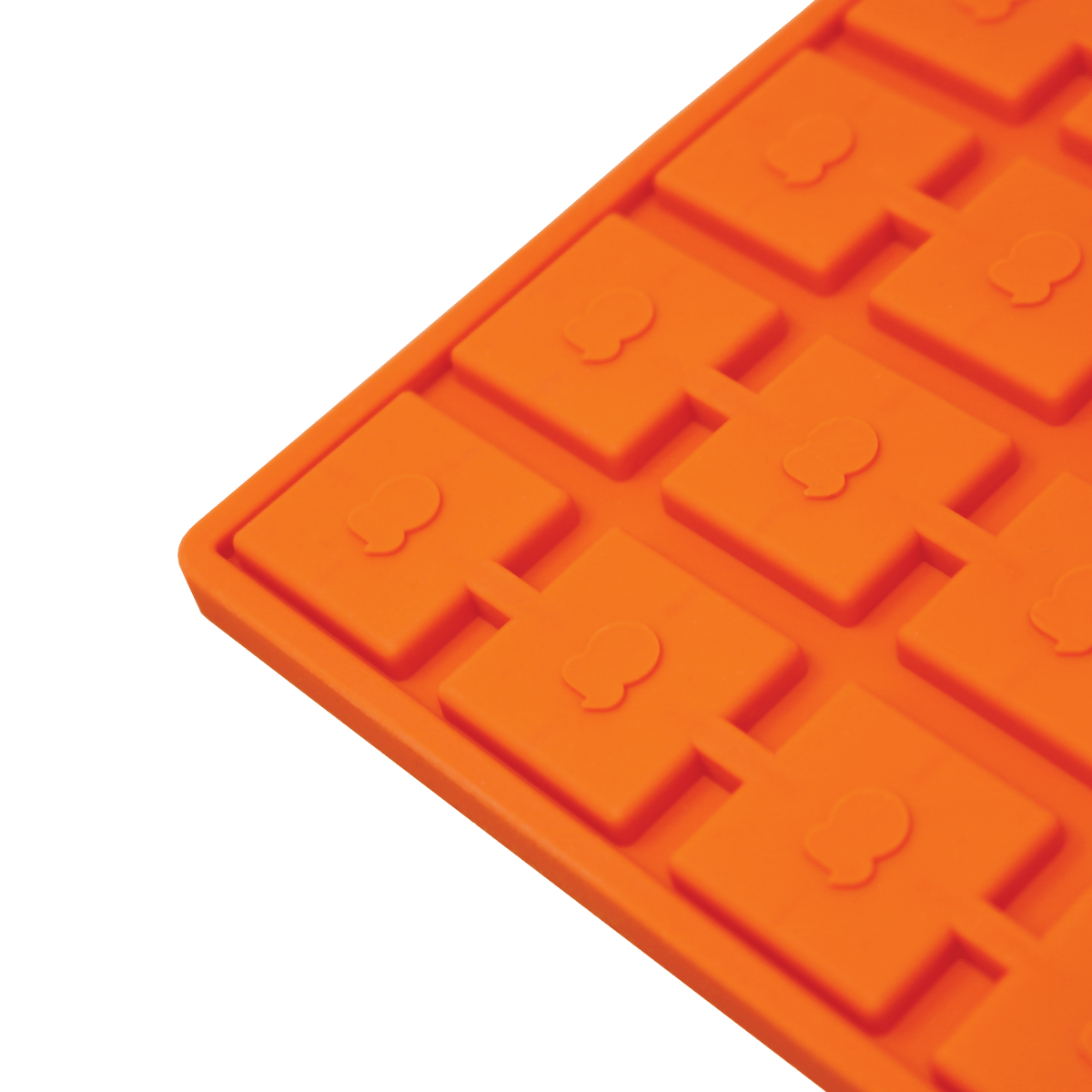 A close-up, angled view of the Scored Gummy Molds, showcasing the grid pattern of the silicone mold.