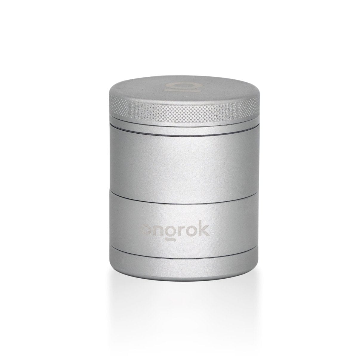 Front view of the 5 Piece Storage Grinder, a cylindrical metal container with a textured surface and simple design.