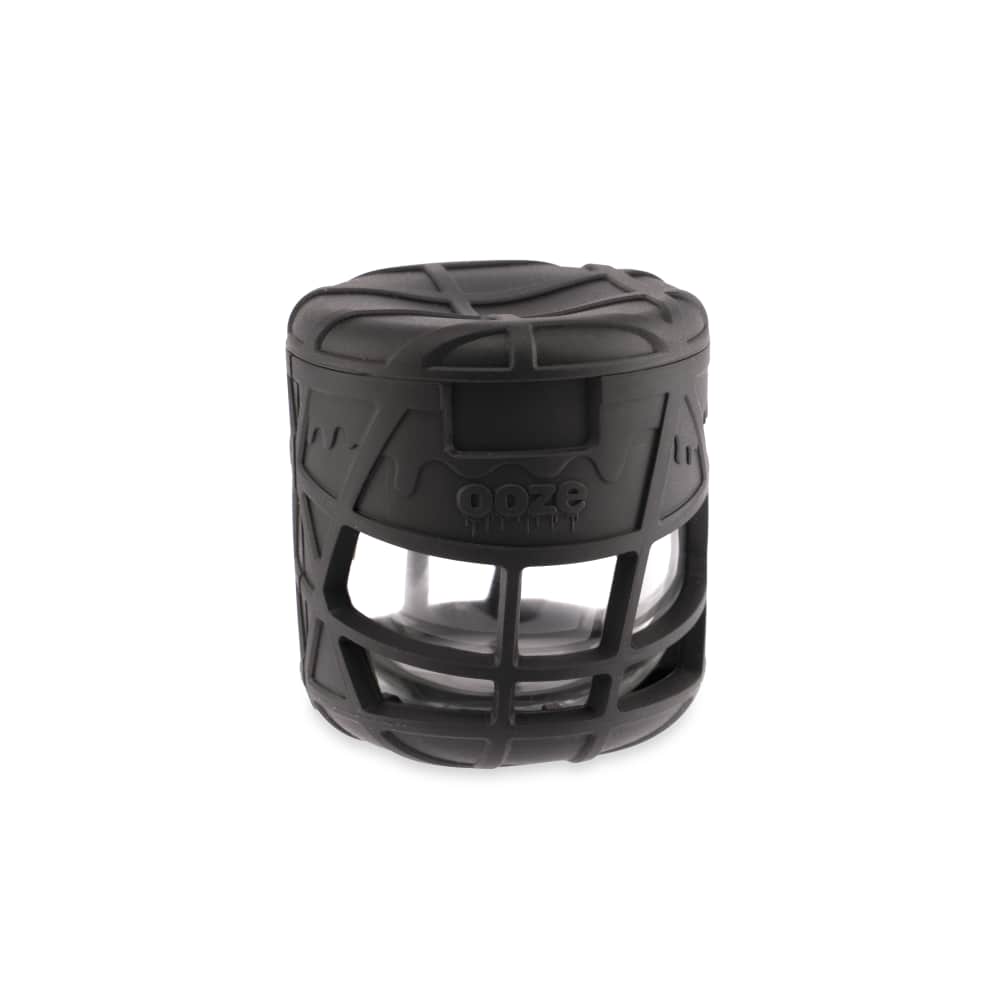 A close-up of the Ooze Prizm Silicone-Wrapped Glass Stash Jar, showing its textured black silicone exterior and clear glass container.