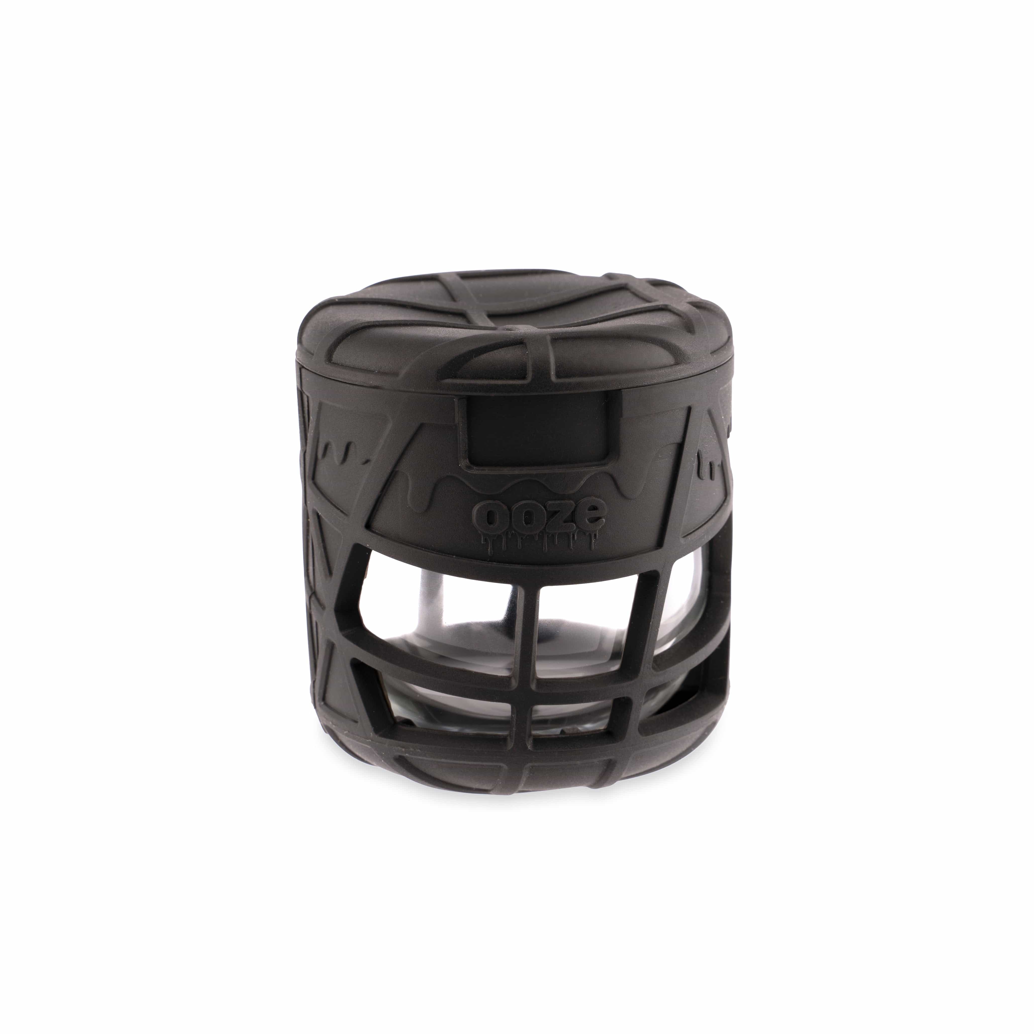 A close-up shot of the Ooze Prizm Silicone-Wrapped Glass Stash Jar, angled to highlight the textured silicone grip.