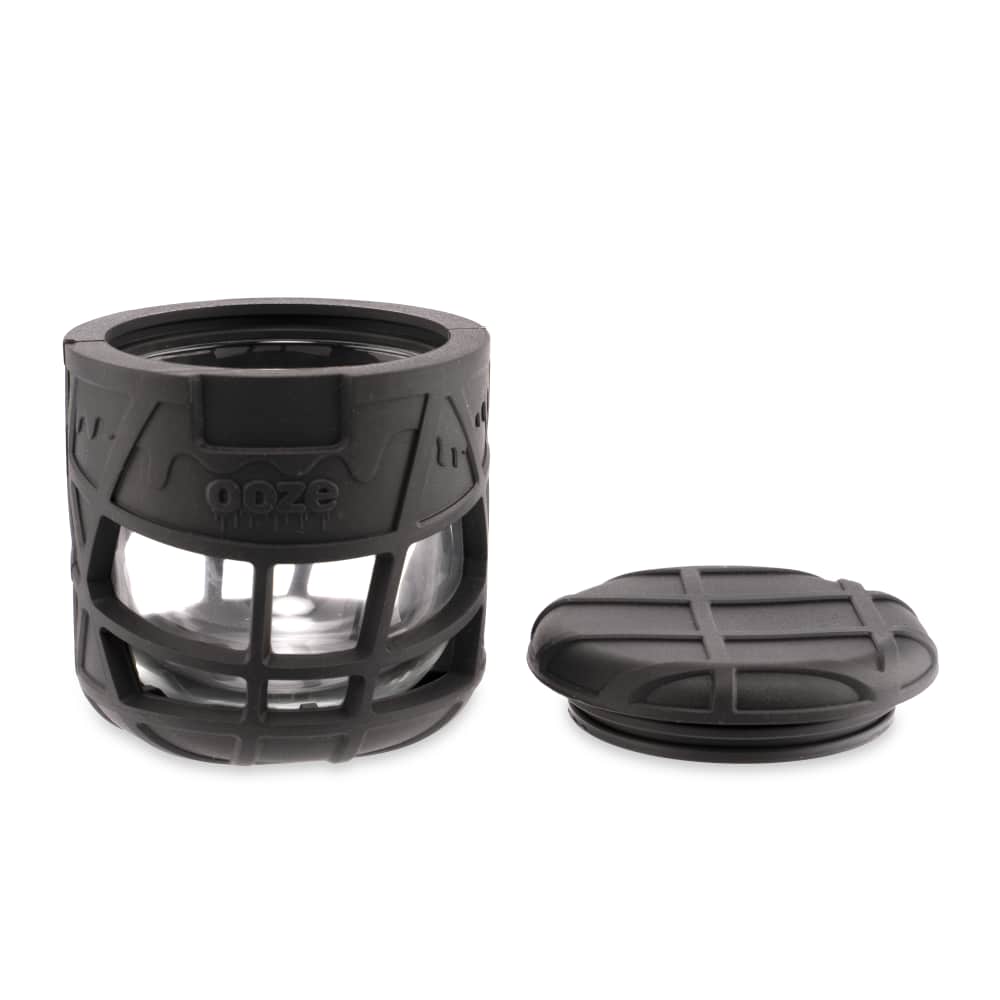 A top-down view of the Ooze Prizm Silicone-Wrapped Glass Stash Jar, showing its dark silicone exterior and clear glass interior.