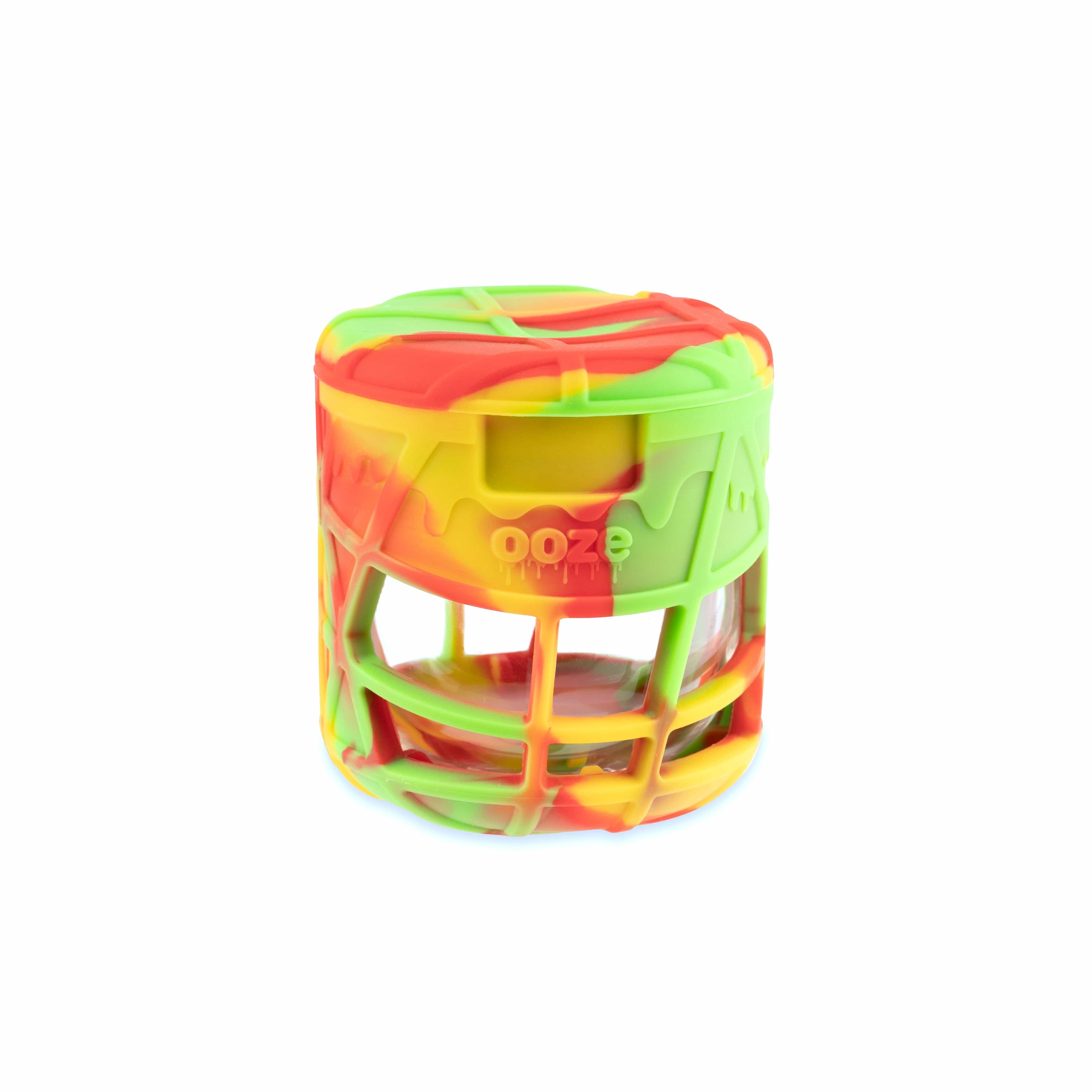 A slightly angled view of the Ooze Prizm Silicone-Wrapped Glass Stash Jar, showcasing its clear glass and colorful silicone grip.