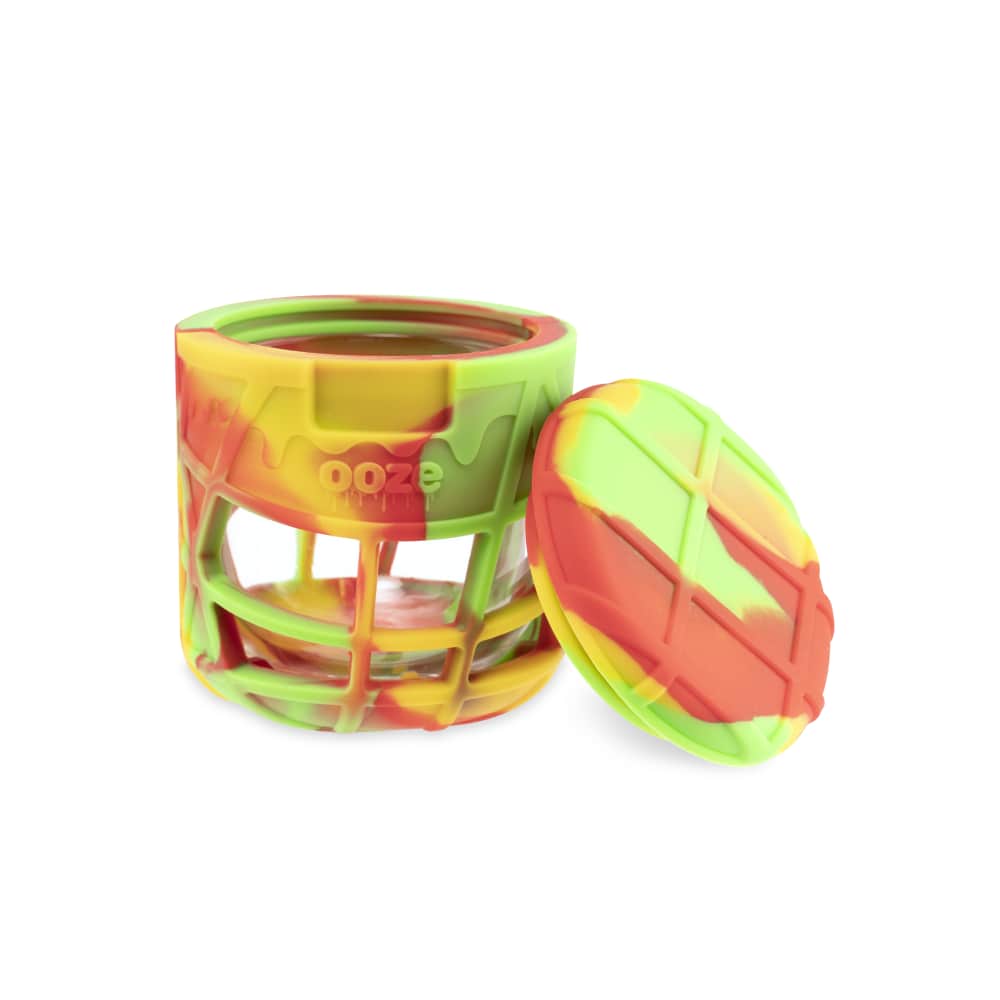 A slightly angled view of the Ooze Prizm Silicone-Wrapped Glass Stash Jar, showcasing its colorful, textured silicone exterior.
