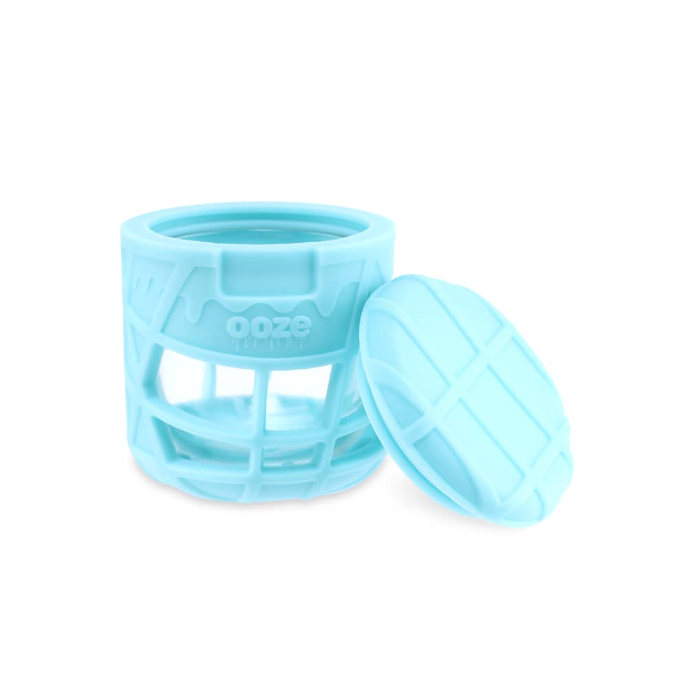 A slightly angled view of the Ooze Prizm Silicone-Wrapped Glass Stash Jar with its lid slightly ajar, shown against a plain white background.