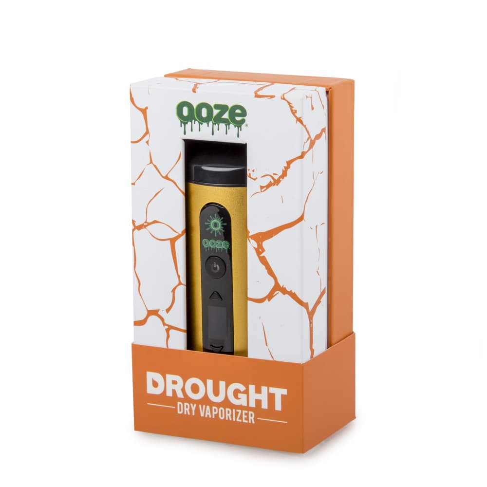 Front view of the Ooze Drought Dry Herb Vaporizer Kit in its packaging, showing a close-up of the device’s angular, silver-toned body.
