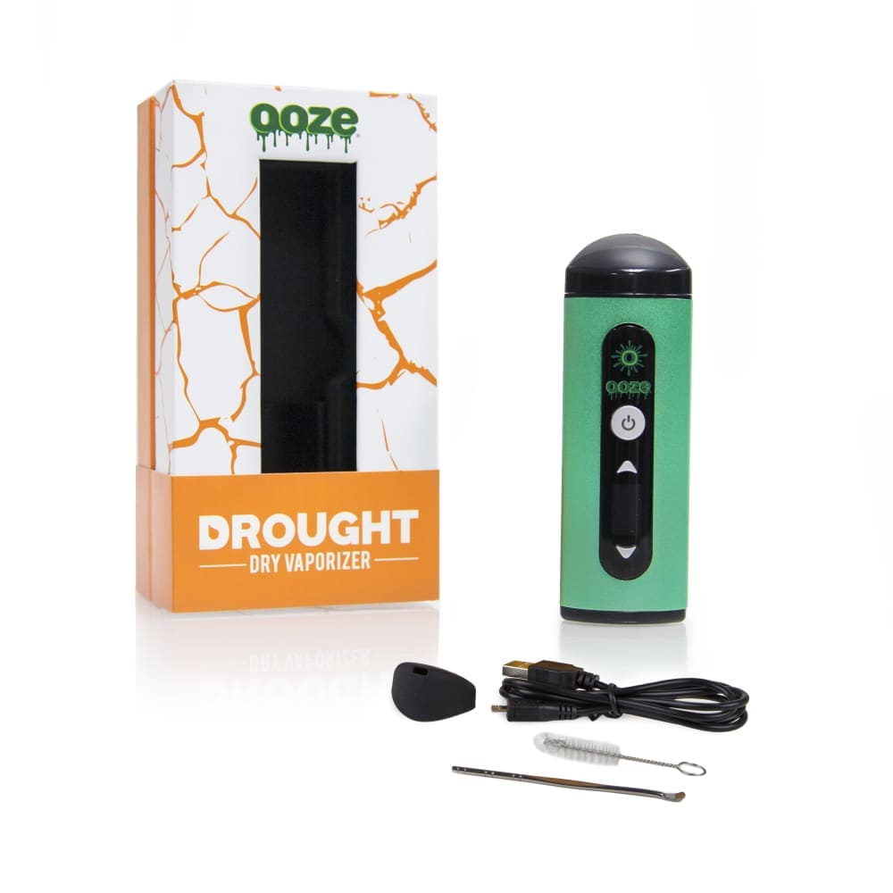 The Ooze Drought Dry Herb Vaporizer Kit is shown in a close-up, angled shot with its included cleaning tools on a white surface.